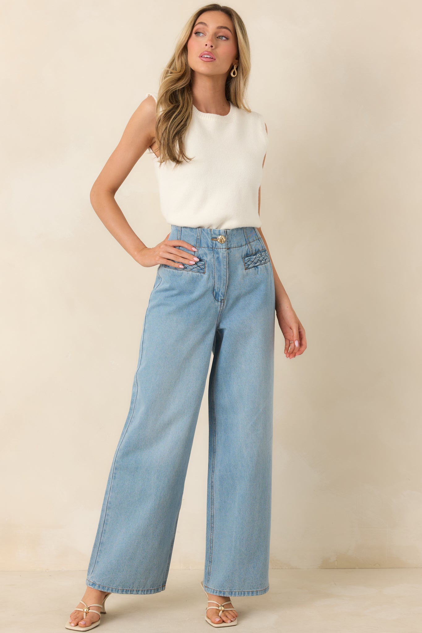 Light wash high-rise jeans with a relaxed straight-leg fit, subtle vintage-inspired details, and classic five-pocket styling for an easy, laid-back look.