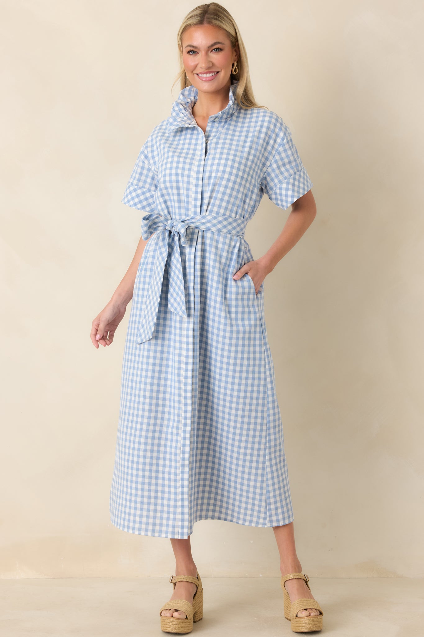 Full-body view showing the lightweight gingham dress featuring a full-length skirt for graceful movement.