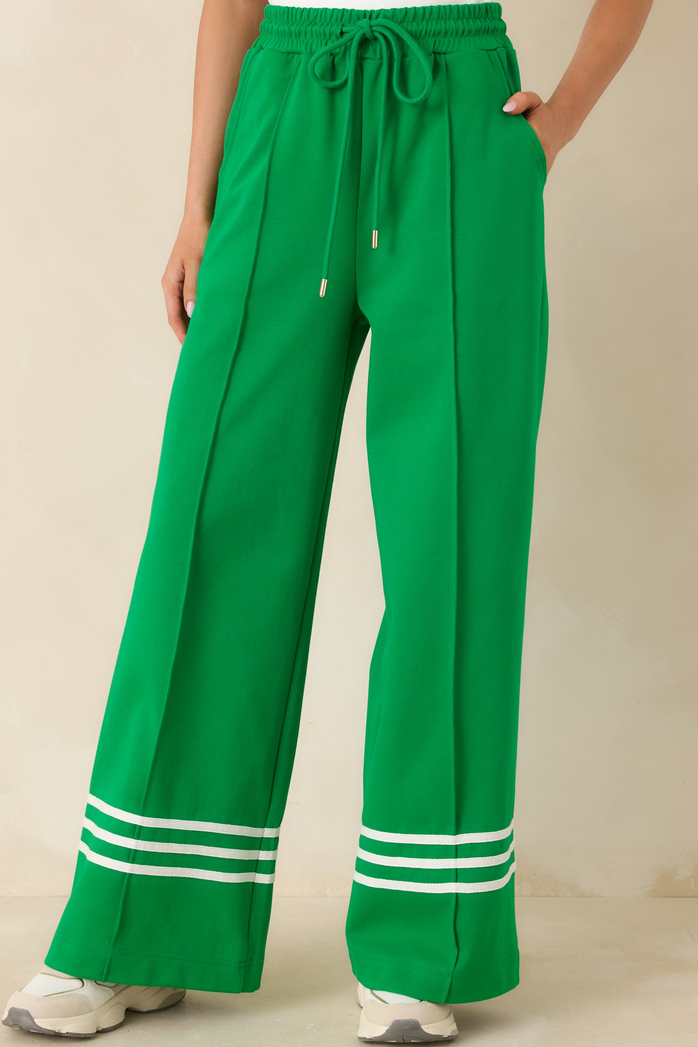 Detailed look at the wide-leg silhouette with subtle contrast stripe detailing along the lower leg.