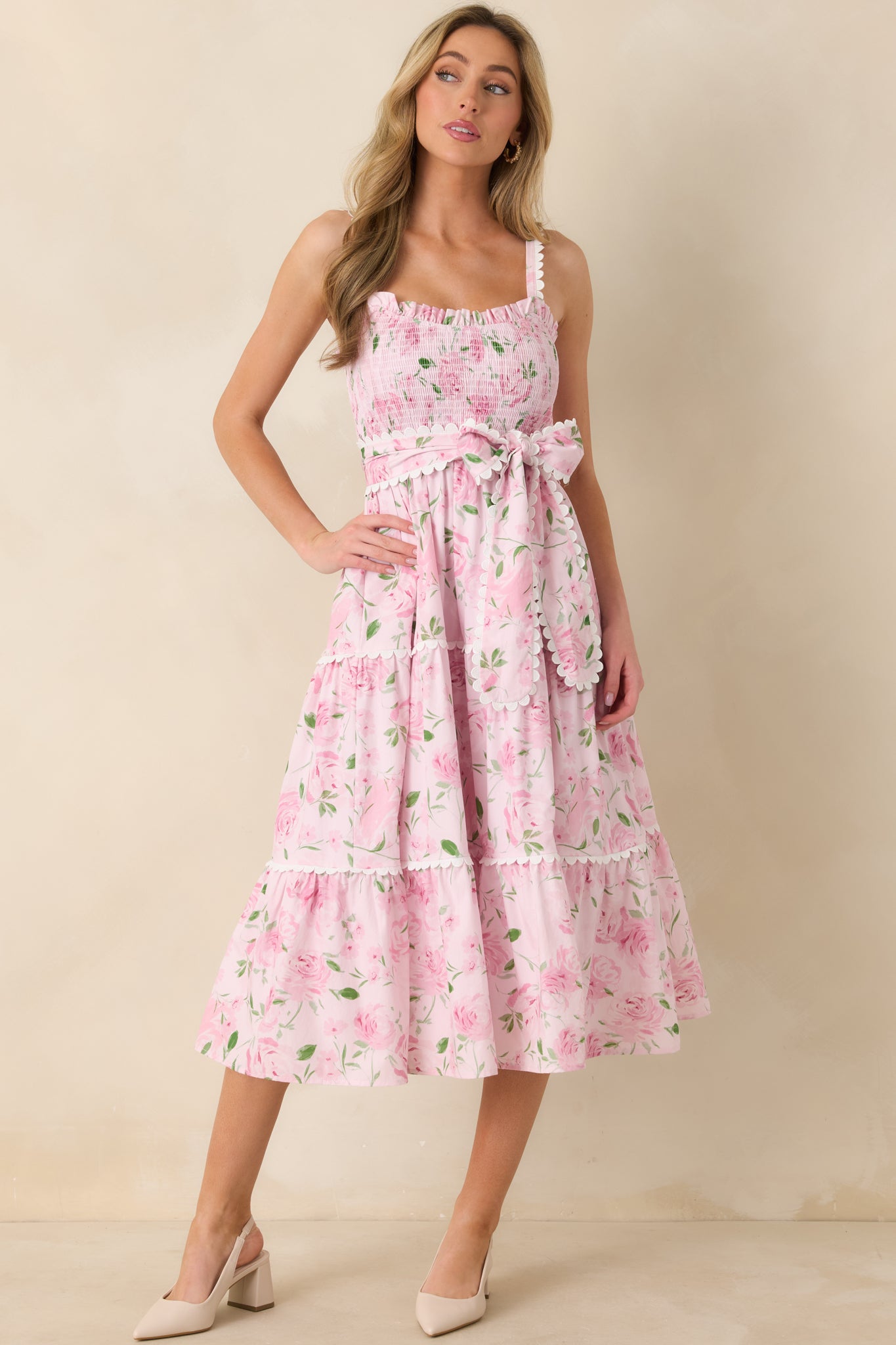 Straight-on front perspective of the pink dress highlighting the lightweight cotton fabric and layered skirt panels.