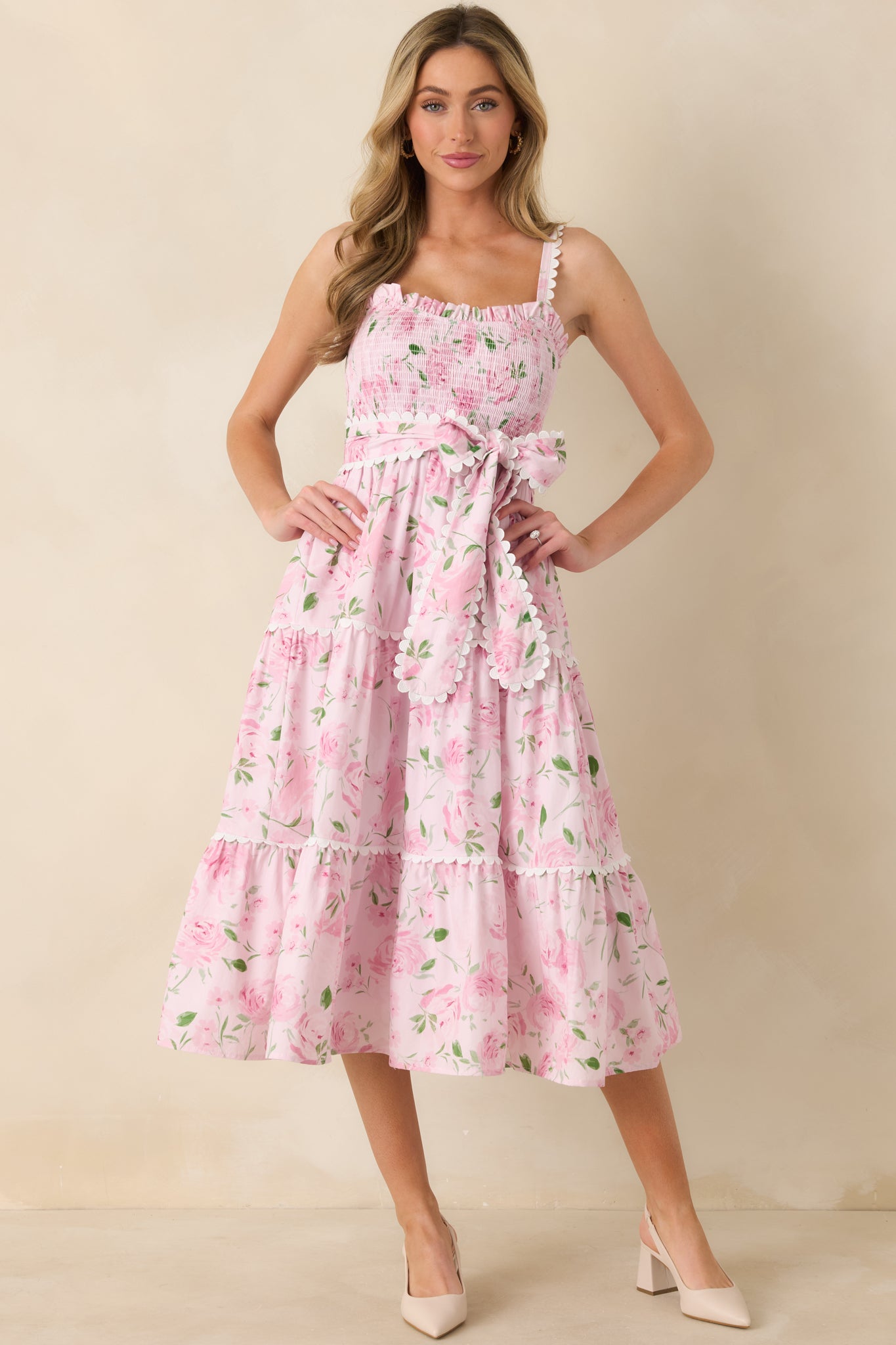 Angled front image showing the comfortable smocked bodice and flattering pull-on style of the maxi dress.