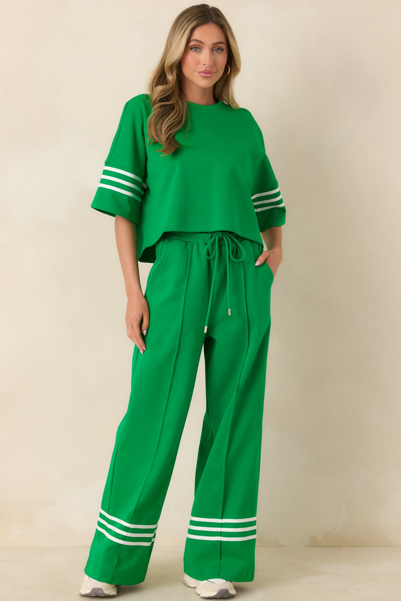 Casual cotton blend pants designed with an adjustable drawstring, roomy side pockets, and clean contrast stripes for a modern touch.