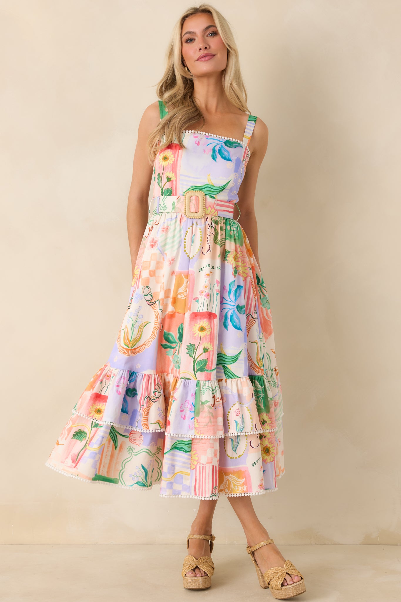 Peach woven midi dress designed with a defined waist, adjustable straps, and softly gathered skirt layers.