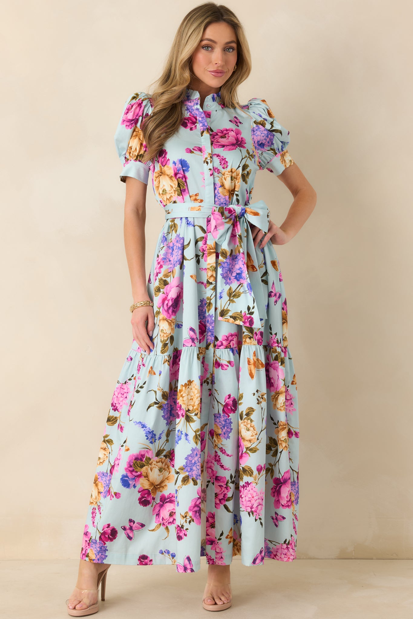 Full-length front image showcasing the puff sleeves, fitted waist, and flowing skirt.