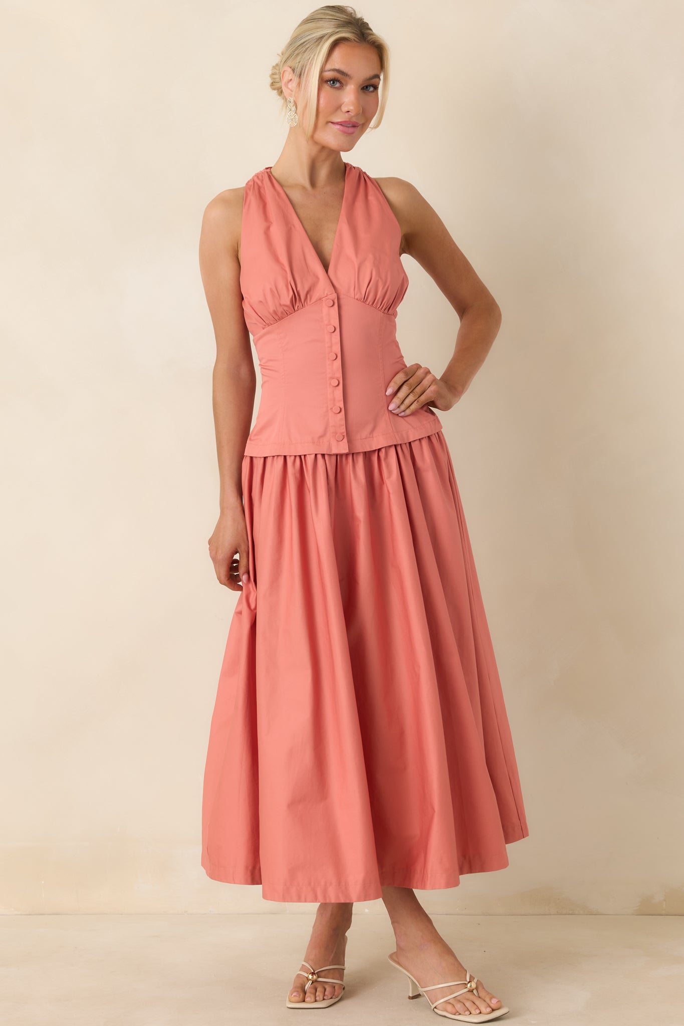 Breathable cotton midi dress with tailored bodice and easy movement.