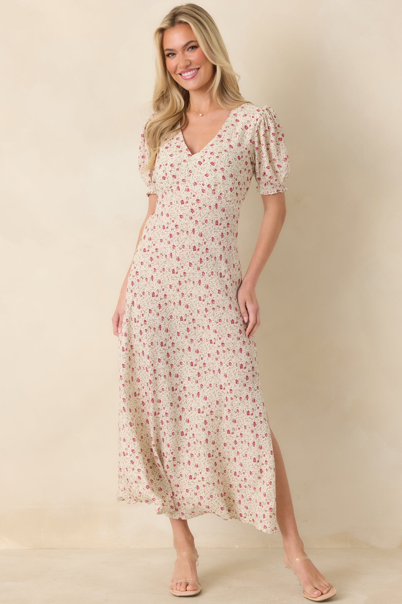 A straight-on front view highlighting the floral pattern, V-neckline, and the way the fabric drapes over the elastic waist and leg slit.