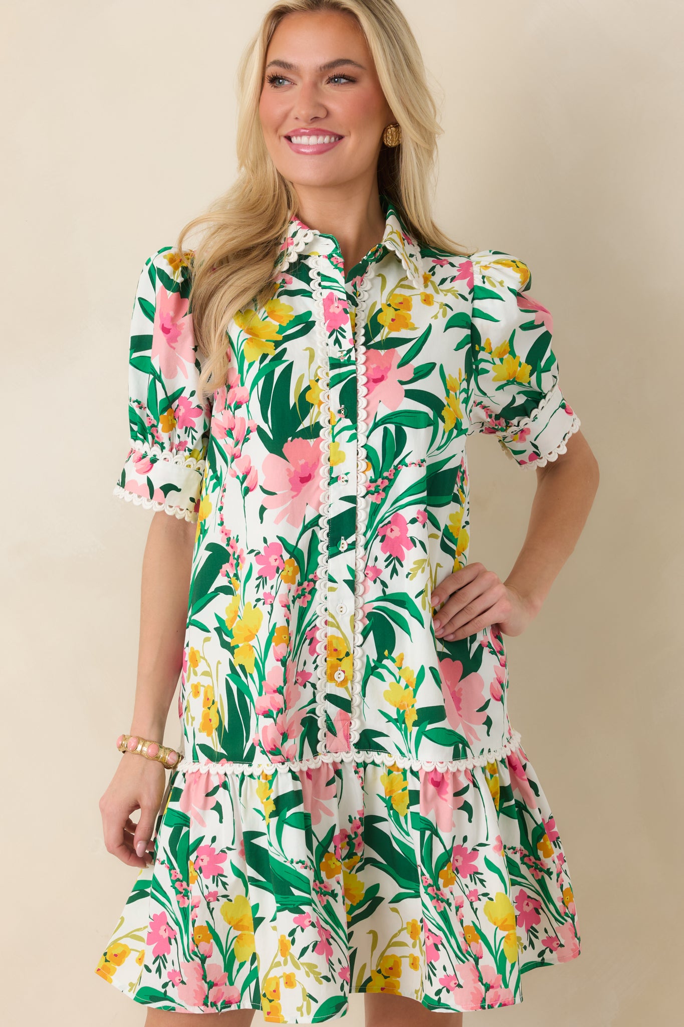 Close front view of the tailored bodice with button-front closure, scalloped placket, and soft puff sleeves.