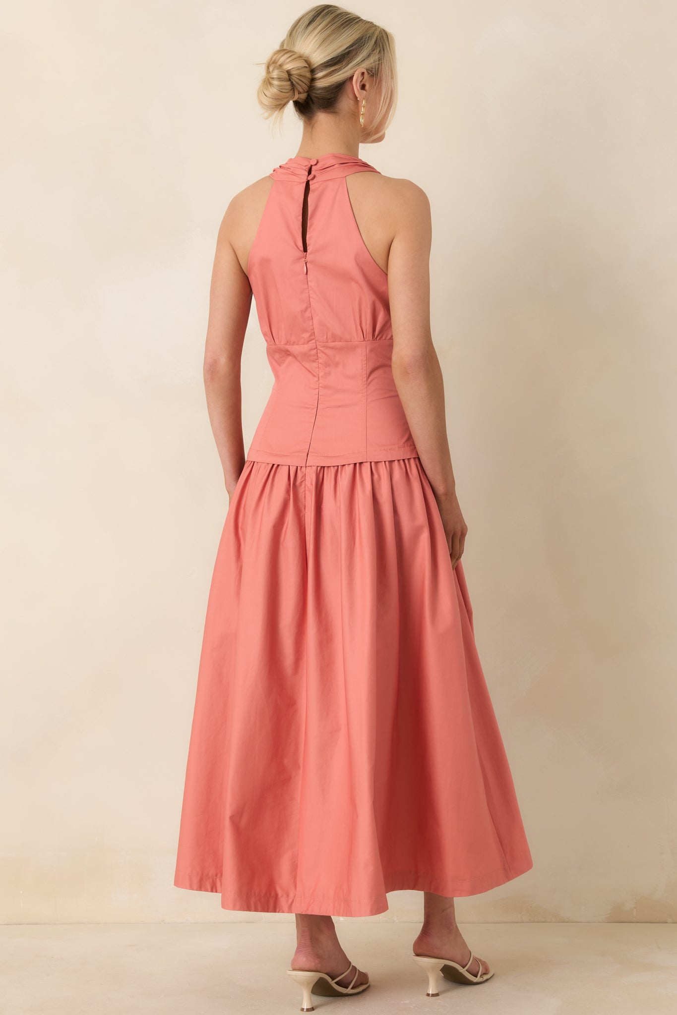 Midi dress with keyhole detail, button closures, and concealed zipper from rear.