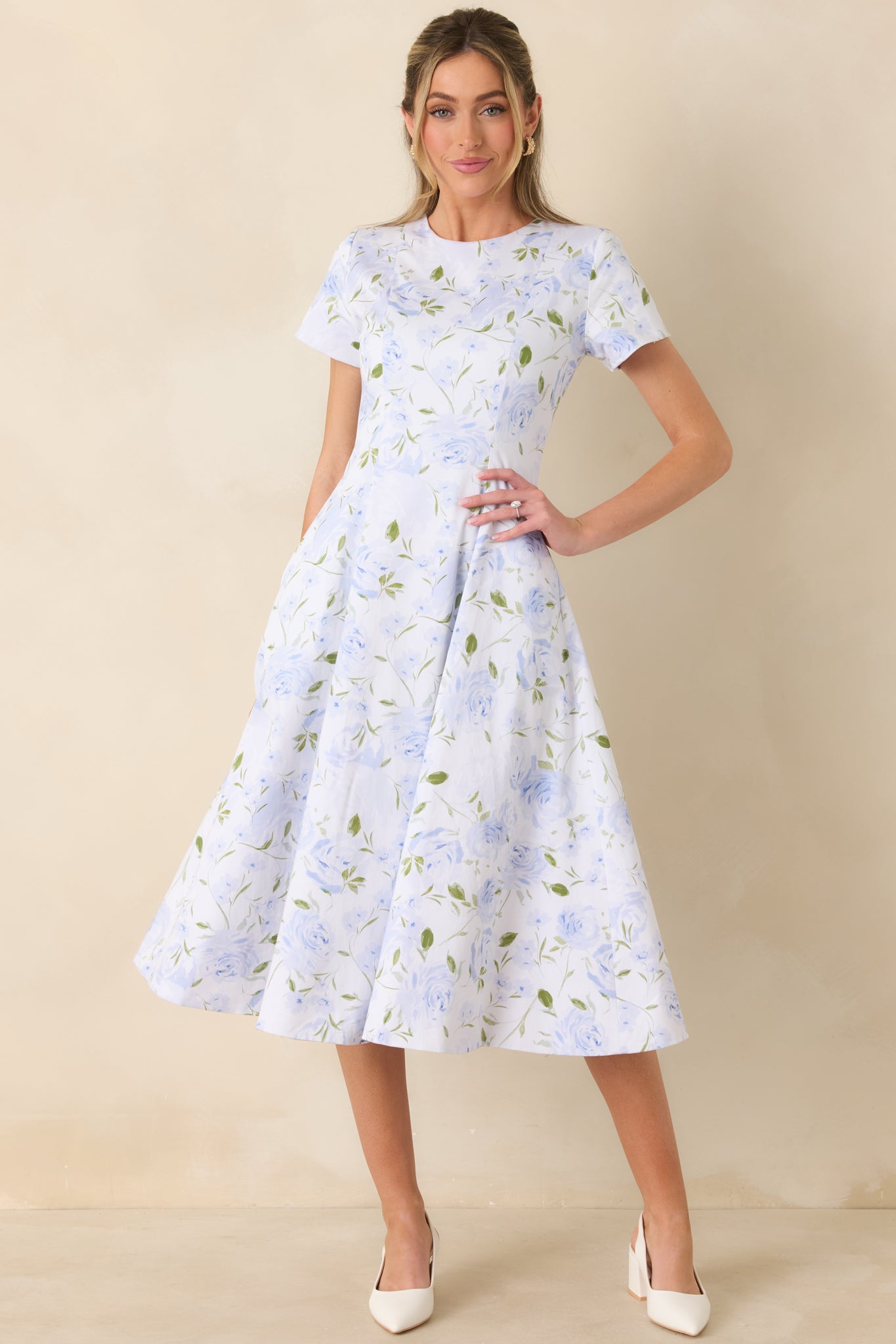 Blue floral reversible midi dress with classic round neckline and sweeping skirt for an easy, flattering fit.