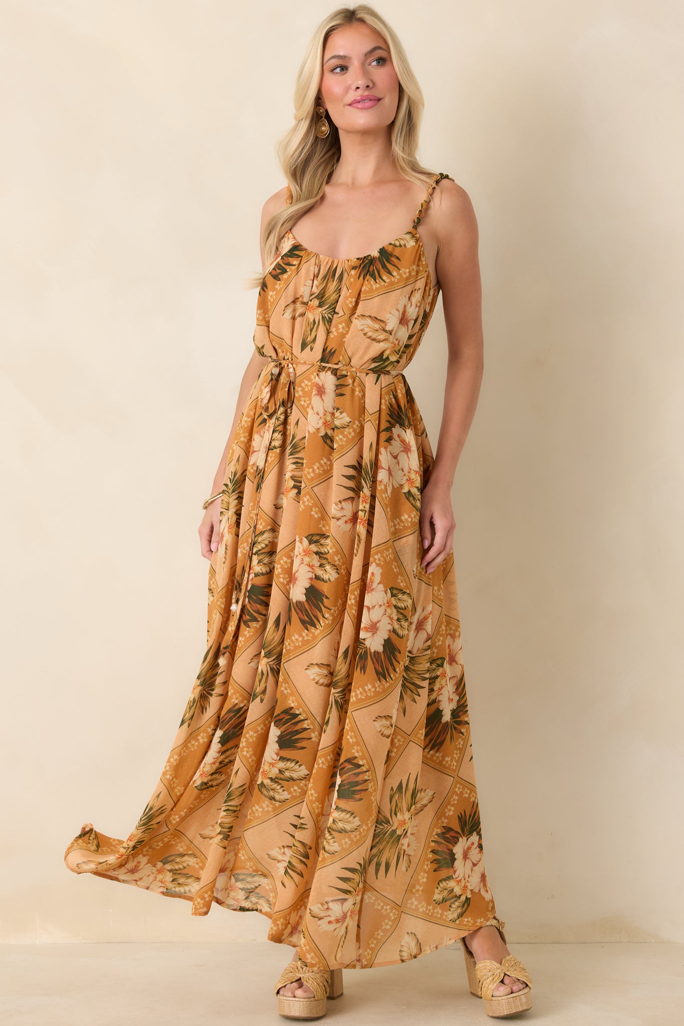 Peach multi tropical print maxi dress with beaded shoulder straps and breezy skirt, showing relaxed vacation-ready style.