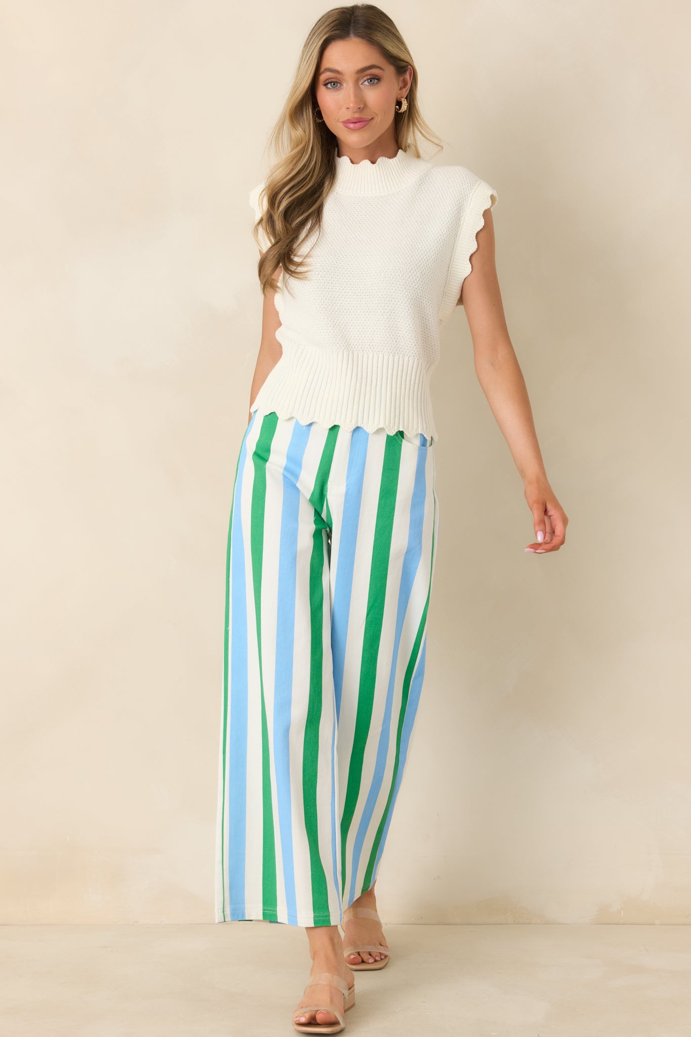 Green and blue striped wide leg pants with a high-rise design, classic button and zipper closure, and clean vertical stripe pattern.