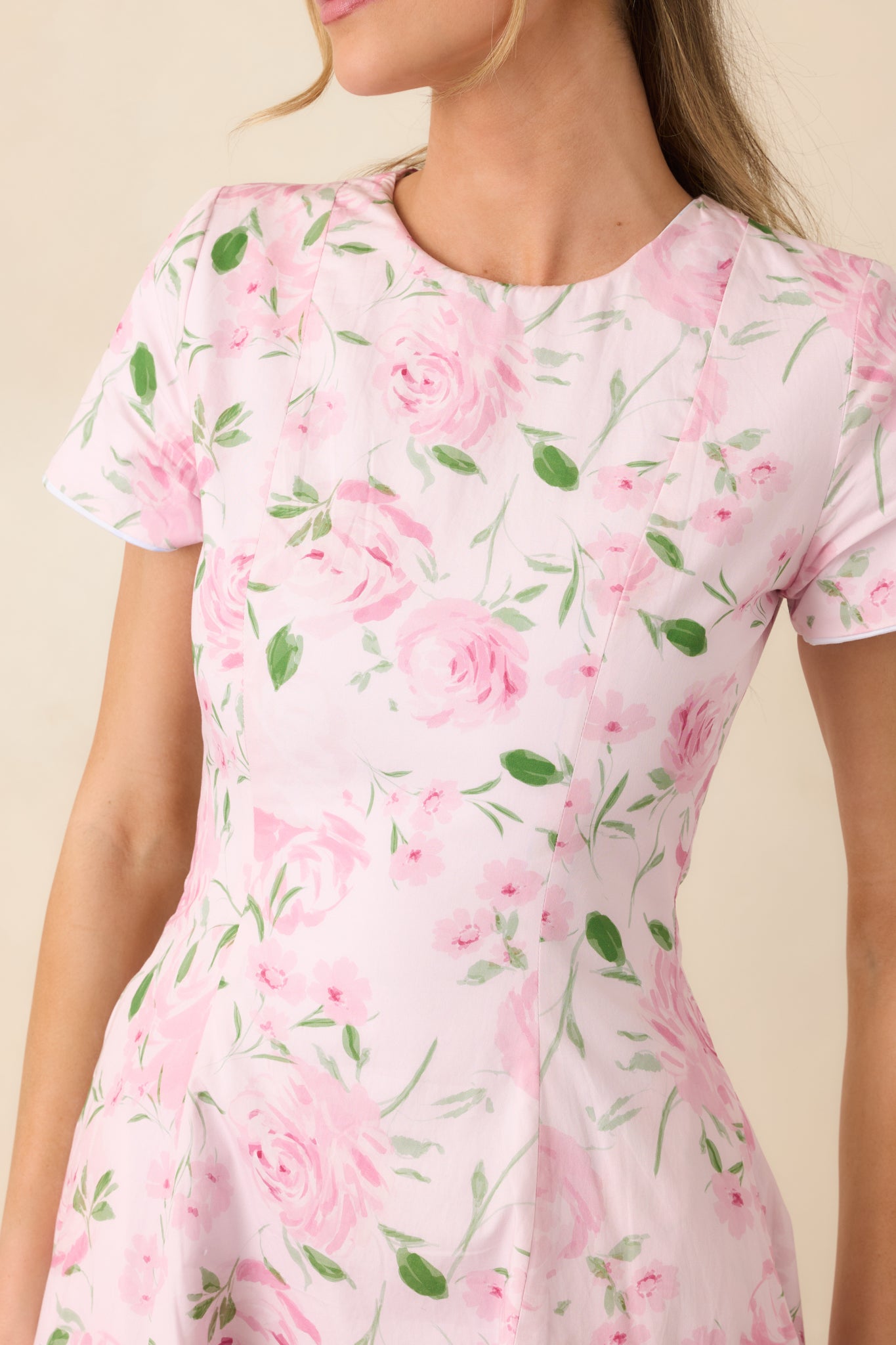 Pink floral fabric detail displaying vibrant print and clean reversible finish.