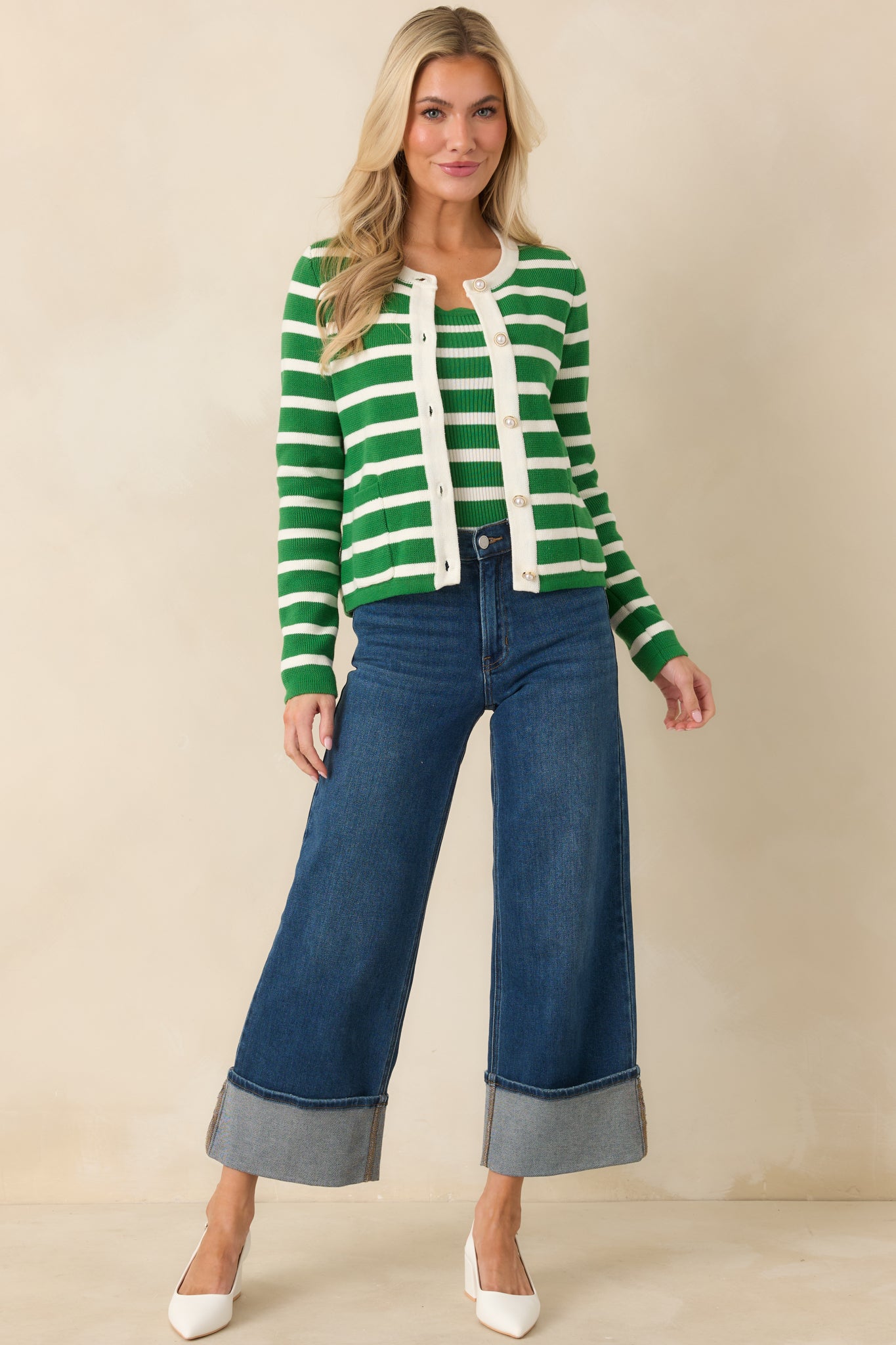 Front-facing full-length view of the green striped cardigan showing the round neckline and button-front closure.