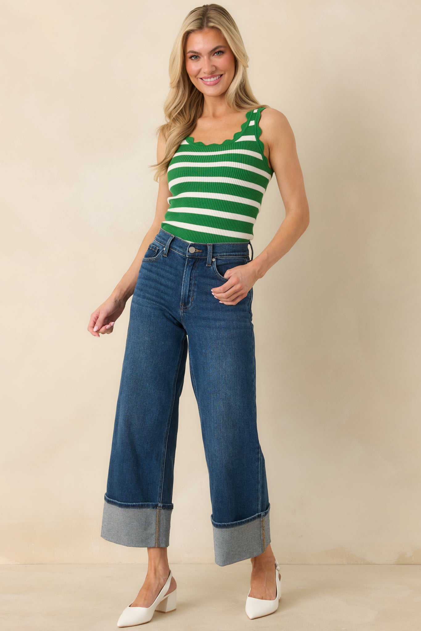 Front-facing image emphasizing the scalloped hem and relaxed fit of the green tank.