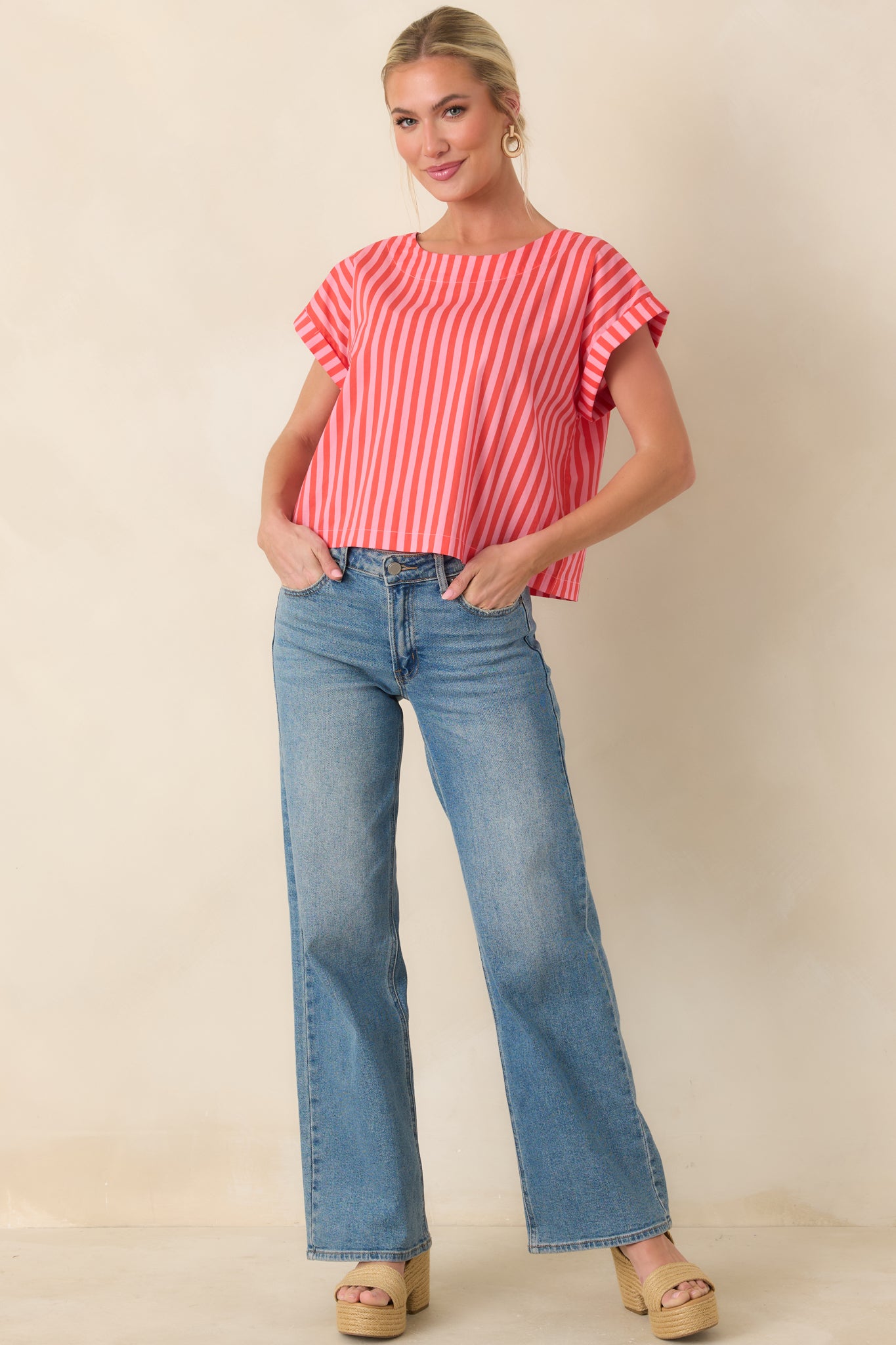 Vibrant striped cotton top designed with a relaxed fit and straight silhouette that falls at a slightly cropped length.
