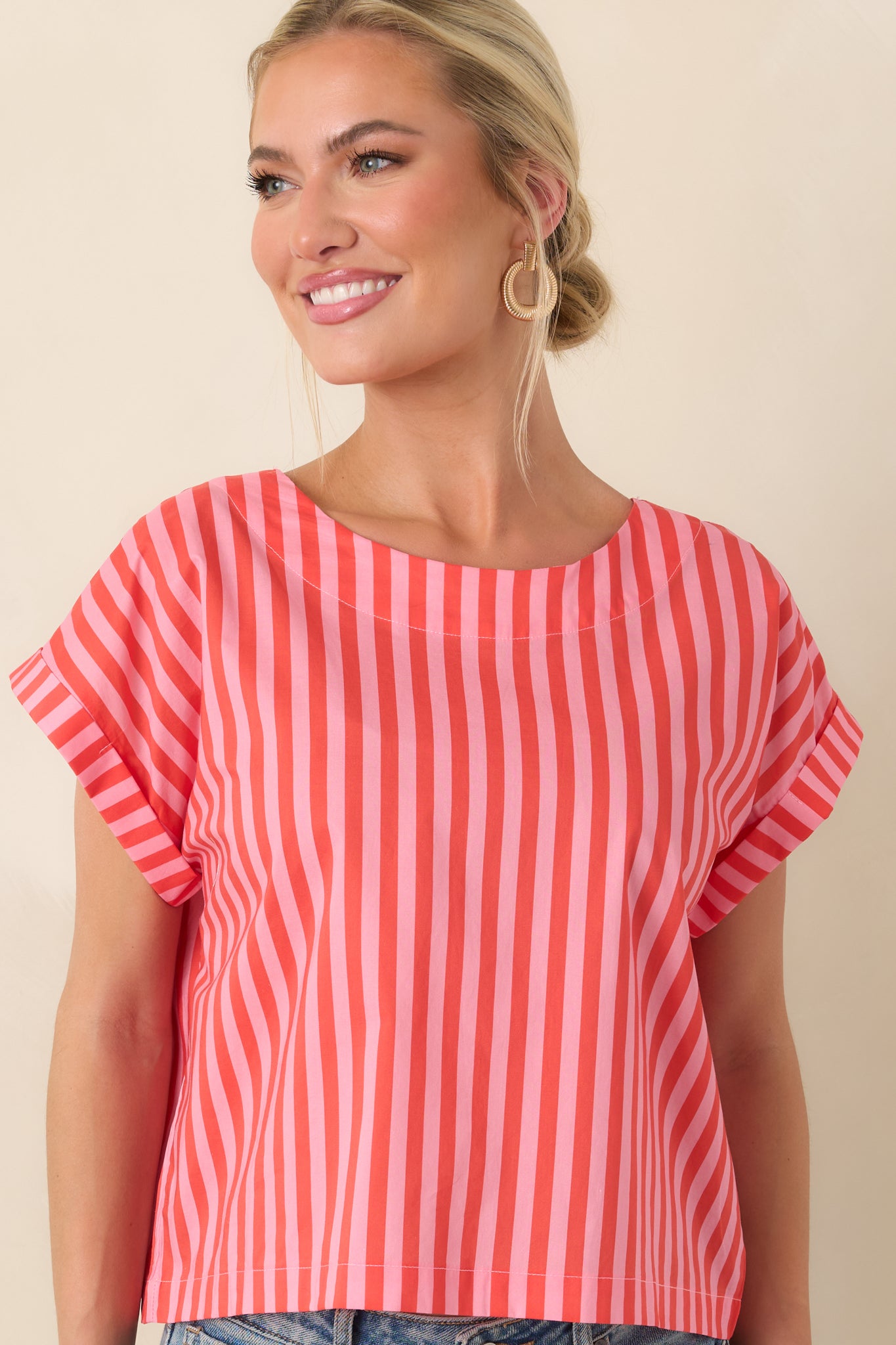 Cotton top highlighting vibrant stripe detailing and an easy, airy fit with a slightly cropped edge.