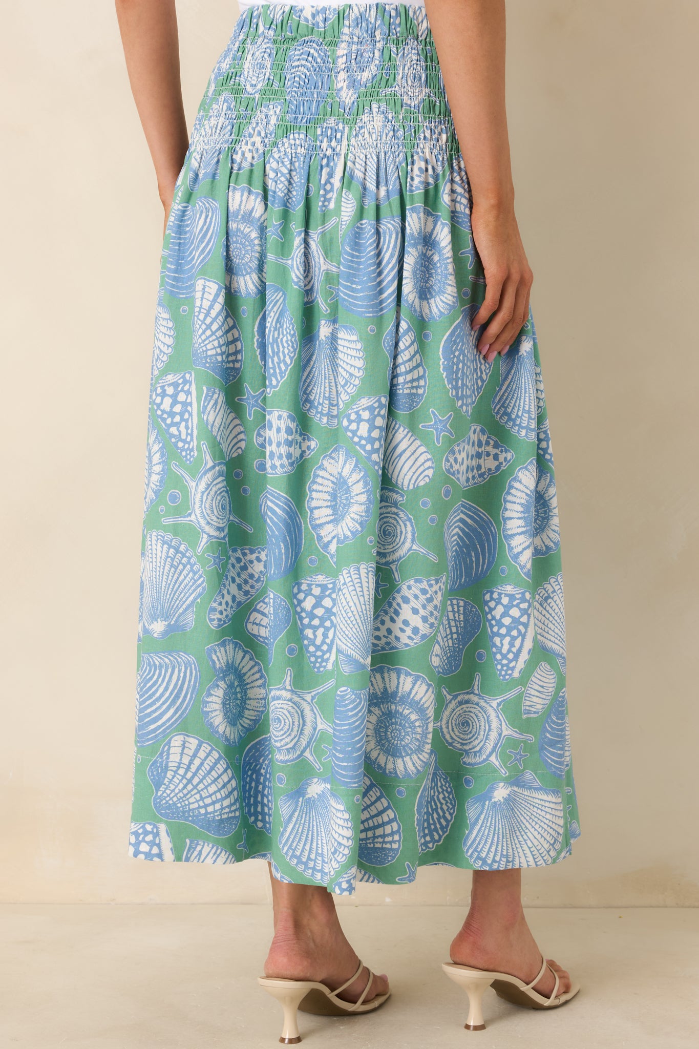 Back view of the maxi skirt featuring an elasticized waist and tiered skirt.