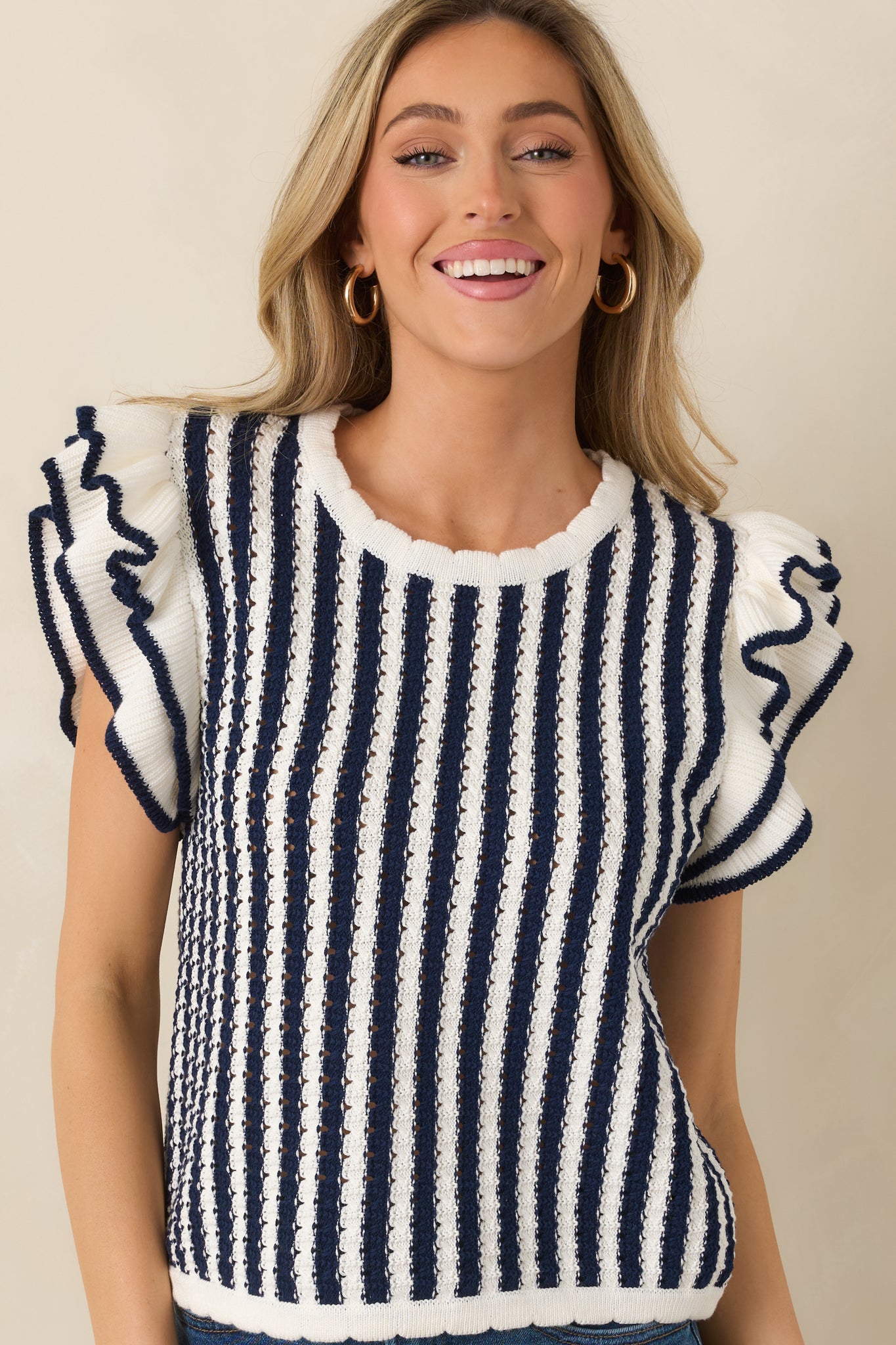 Scalloped hemline detail with vertical stripe alignment.