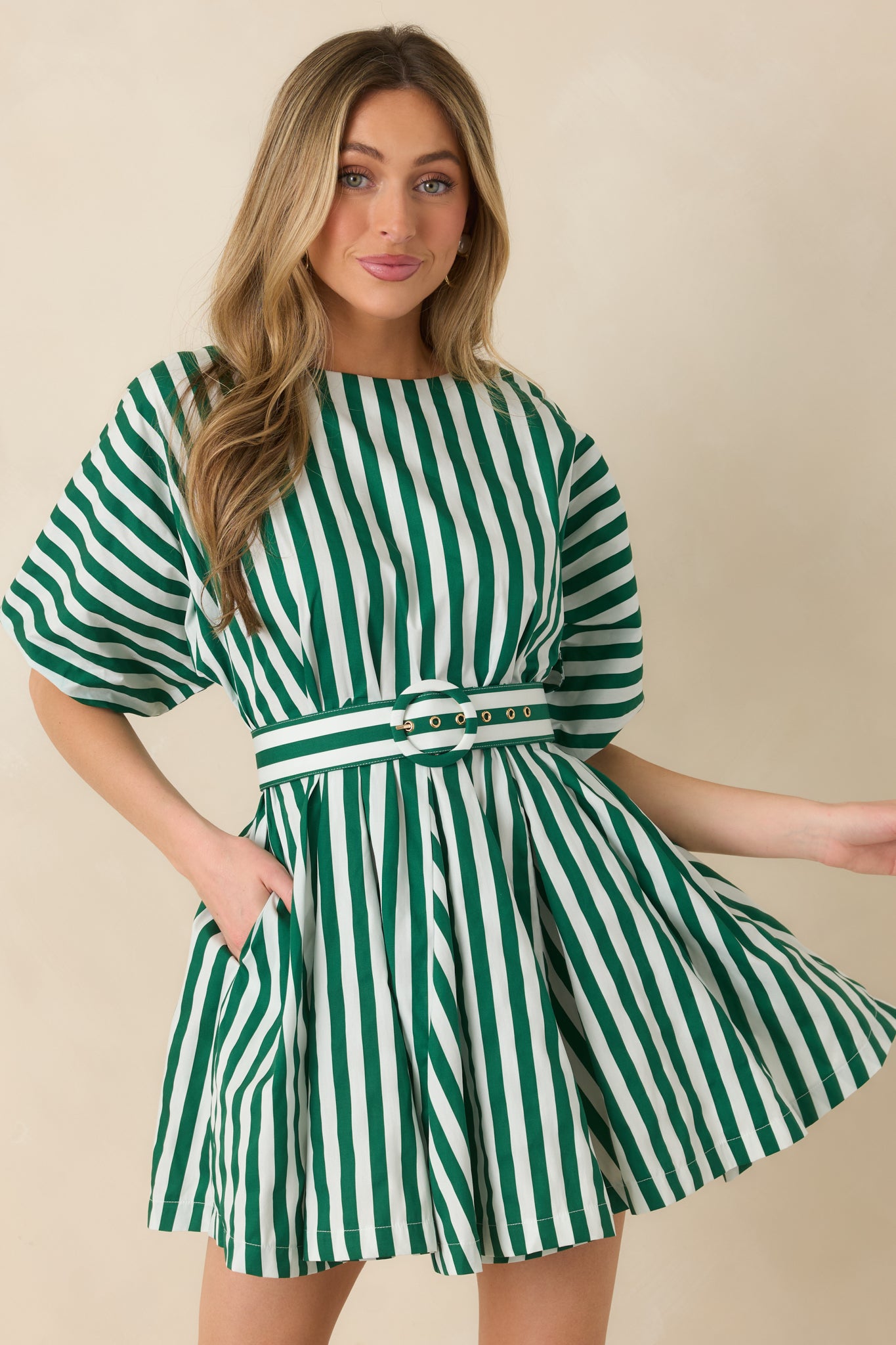 Front view of the striped mini dress focusing on the defined waist belt and lightweight skirt drape.
