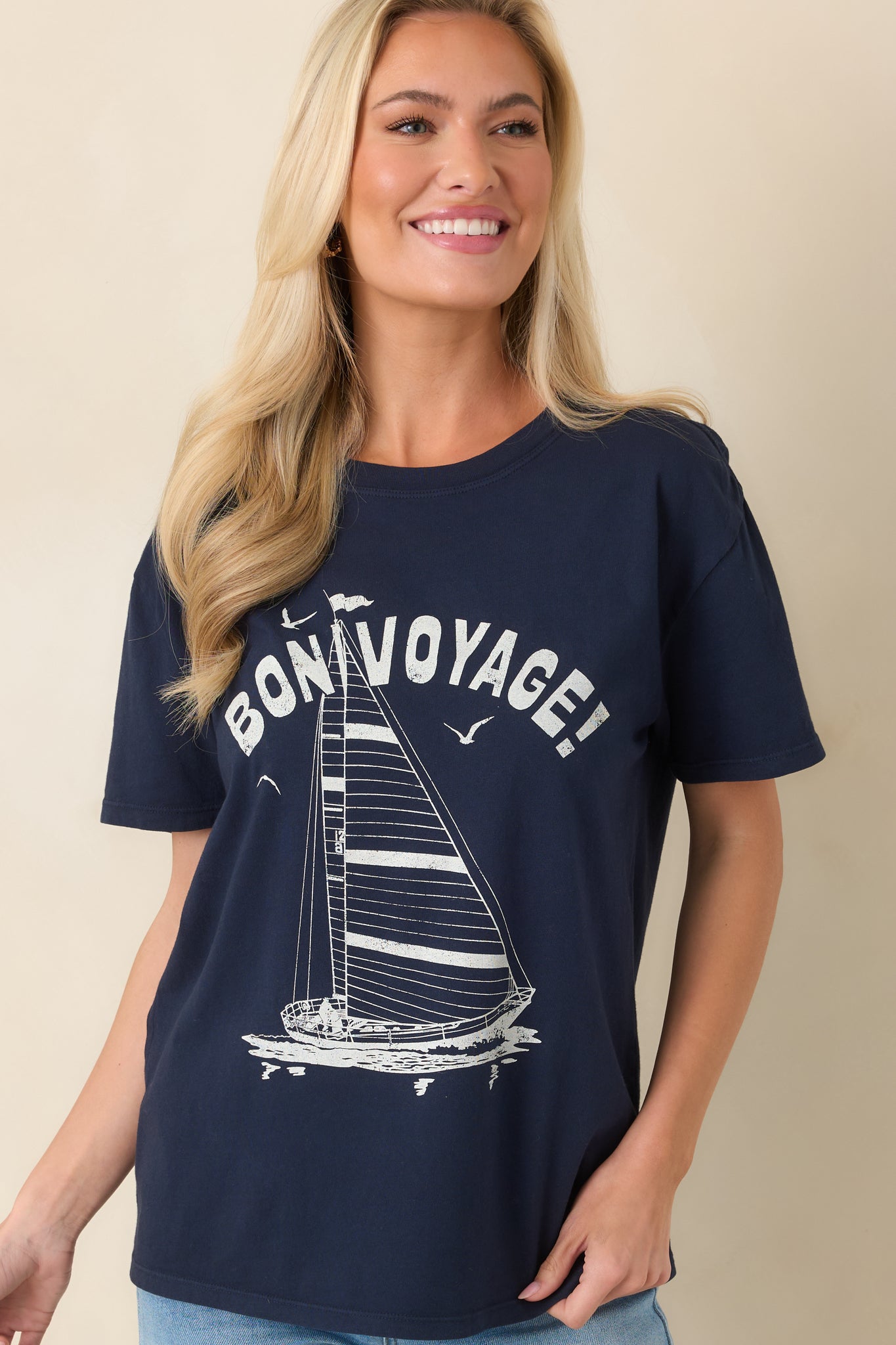 Close-up highlighting the classic crew neckline and smooth fabric texture of the navy tee.