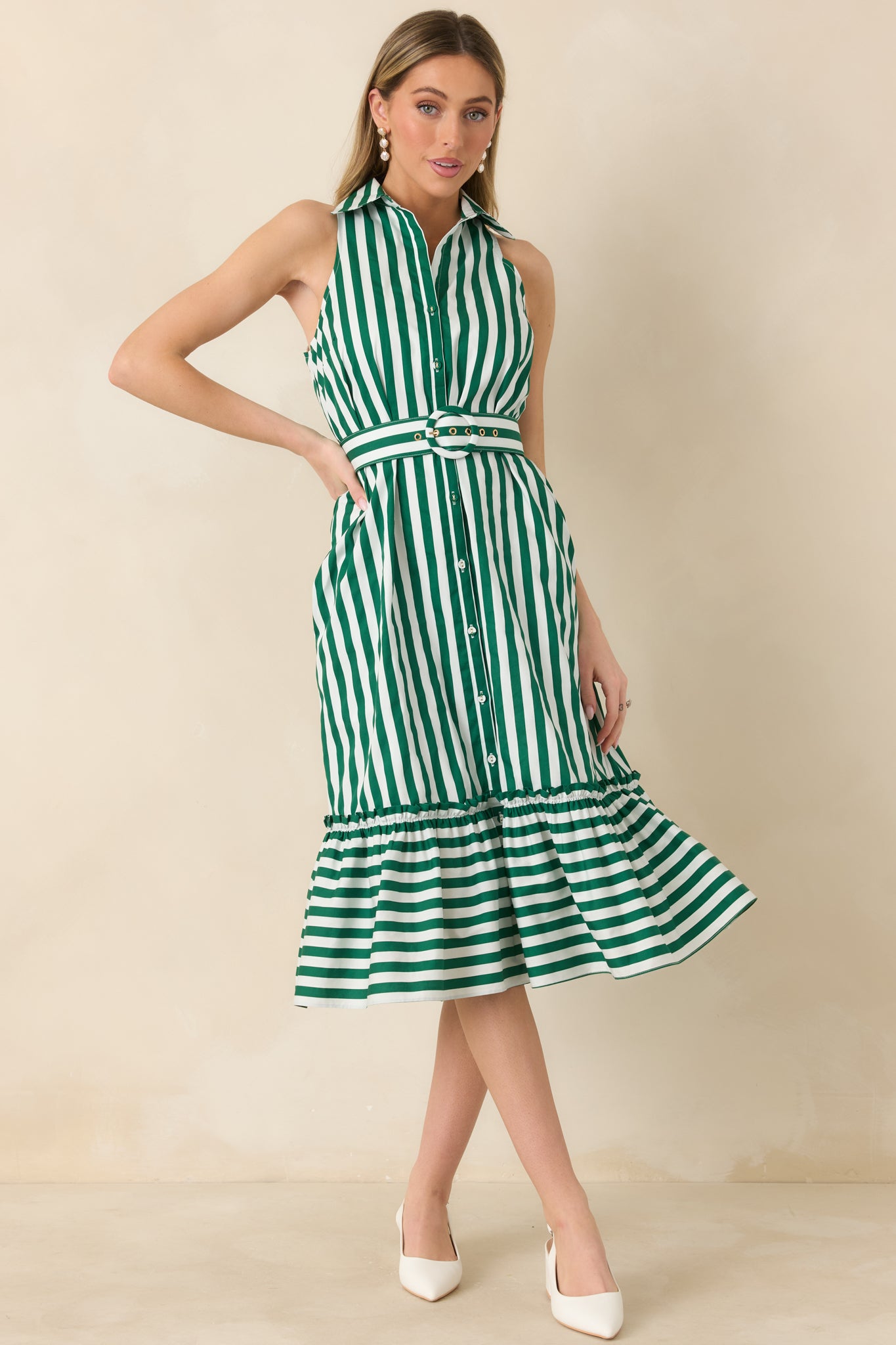 Green and ivory vertically striped midi dress with a tailored collar, button-front bodice, coordinating waist belt, and a softly gathered ruffle hem.