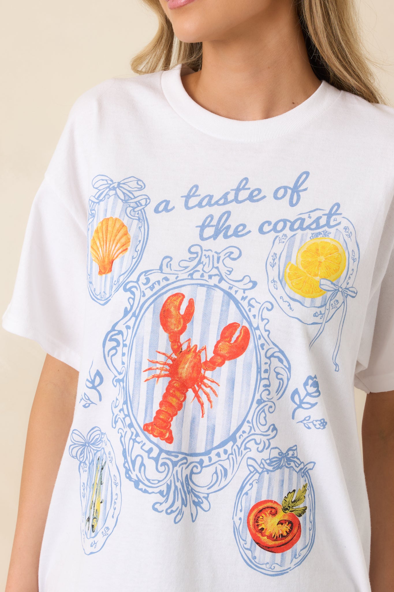 Close look at the coastal screen print and fine cotton weave on the white tee.