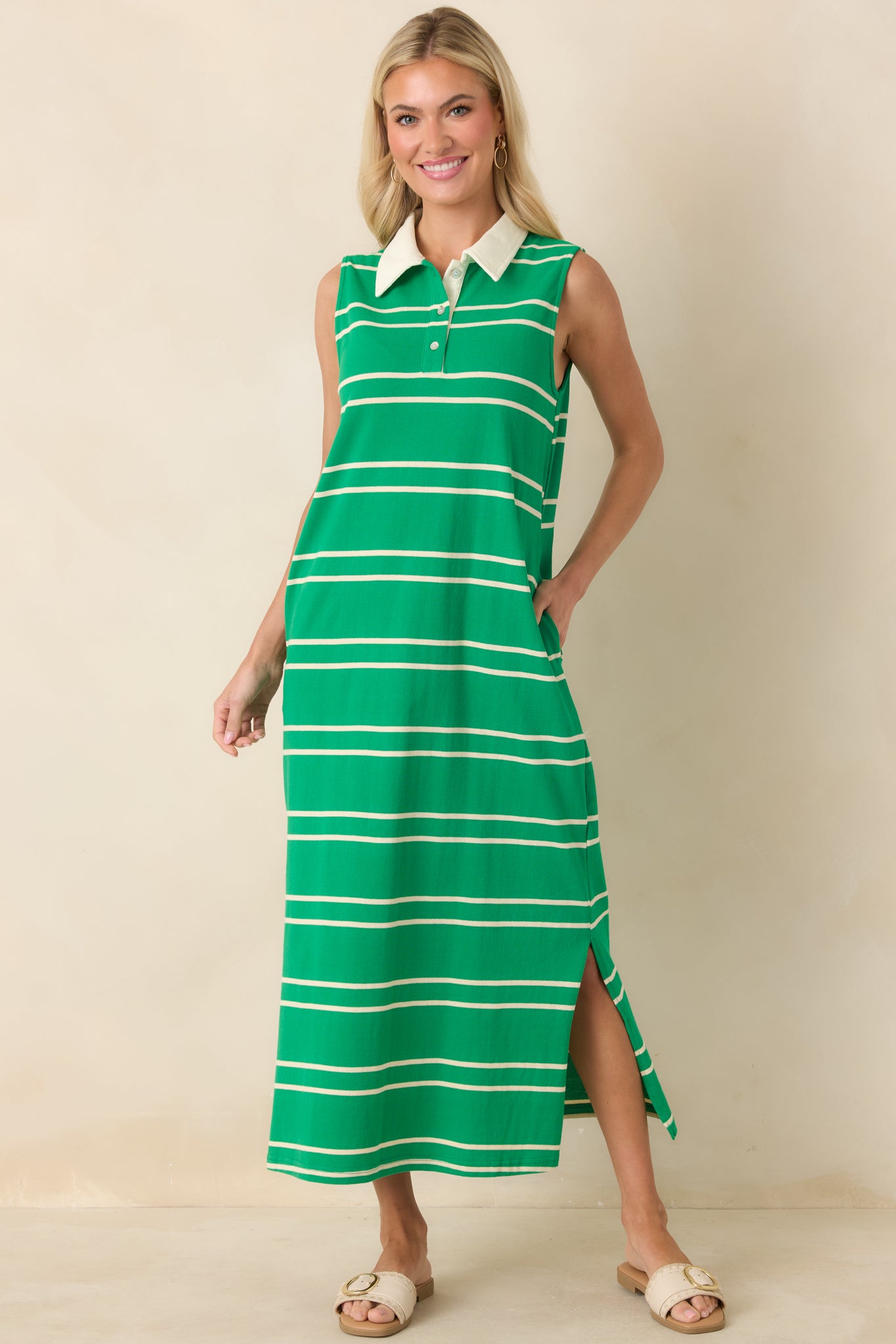 Green striped maxi dress with a sleeveless silhouette, contrast structured collar, and partial button-front closure over a straight, relaxed fit.