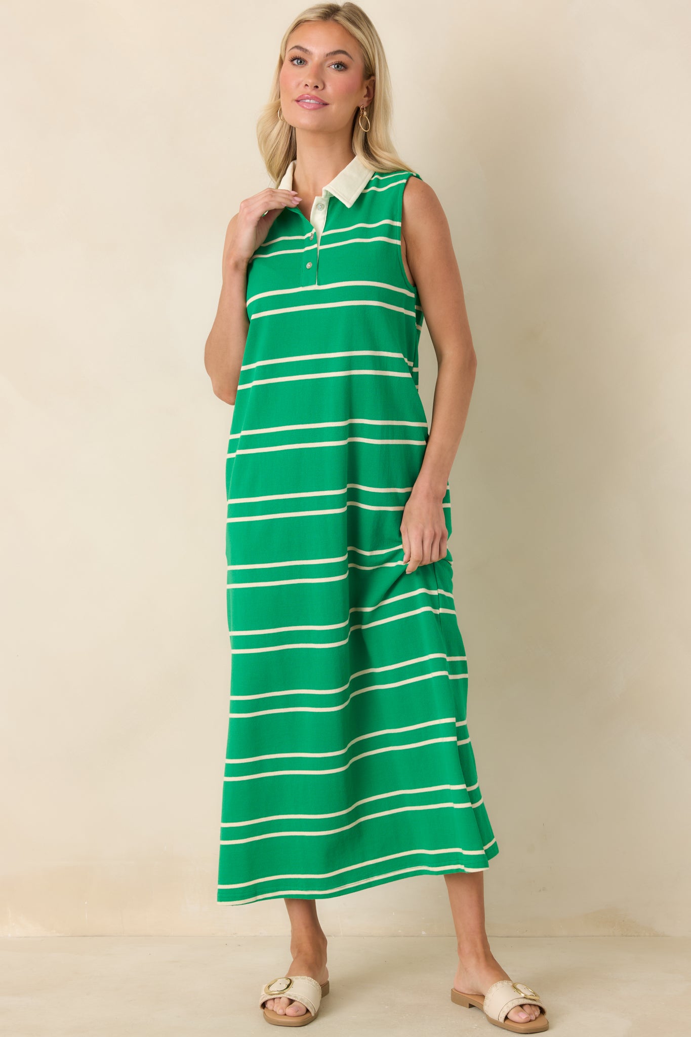 Relaxed-fit sleeveless maxi dress with a partial button-front placket, contrasting collar detail, and soft cotton fabric for comfort.