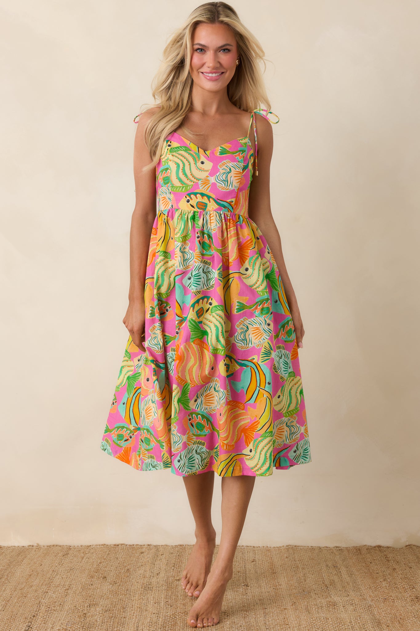 Cotton midi dress with adjustable straps, flowing silhouette, and colorful ocean motif.