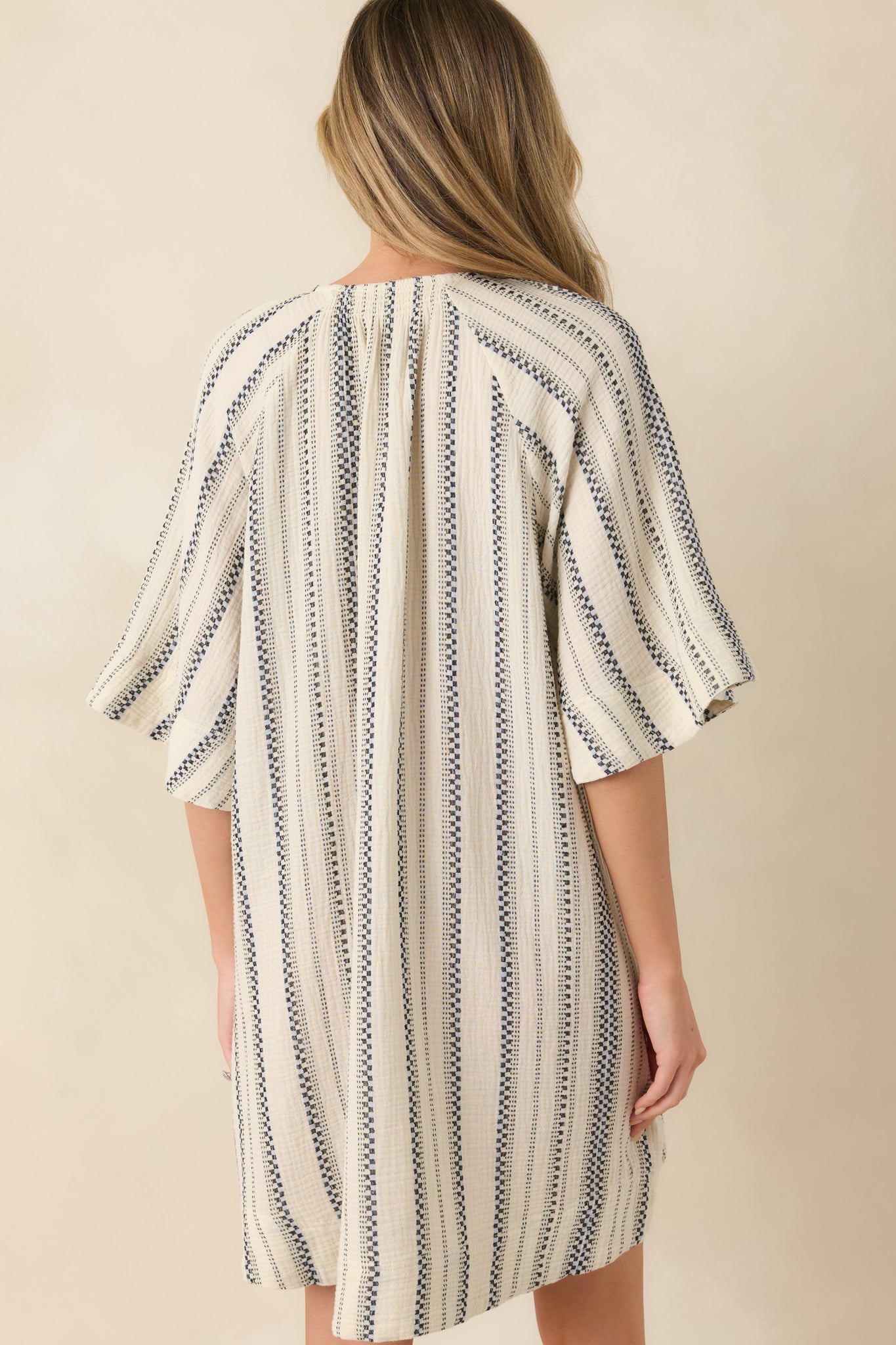 Striped cotton mini dress with relaxed rear silhouette and airy oversized fit.