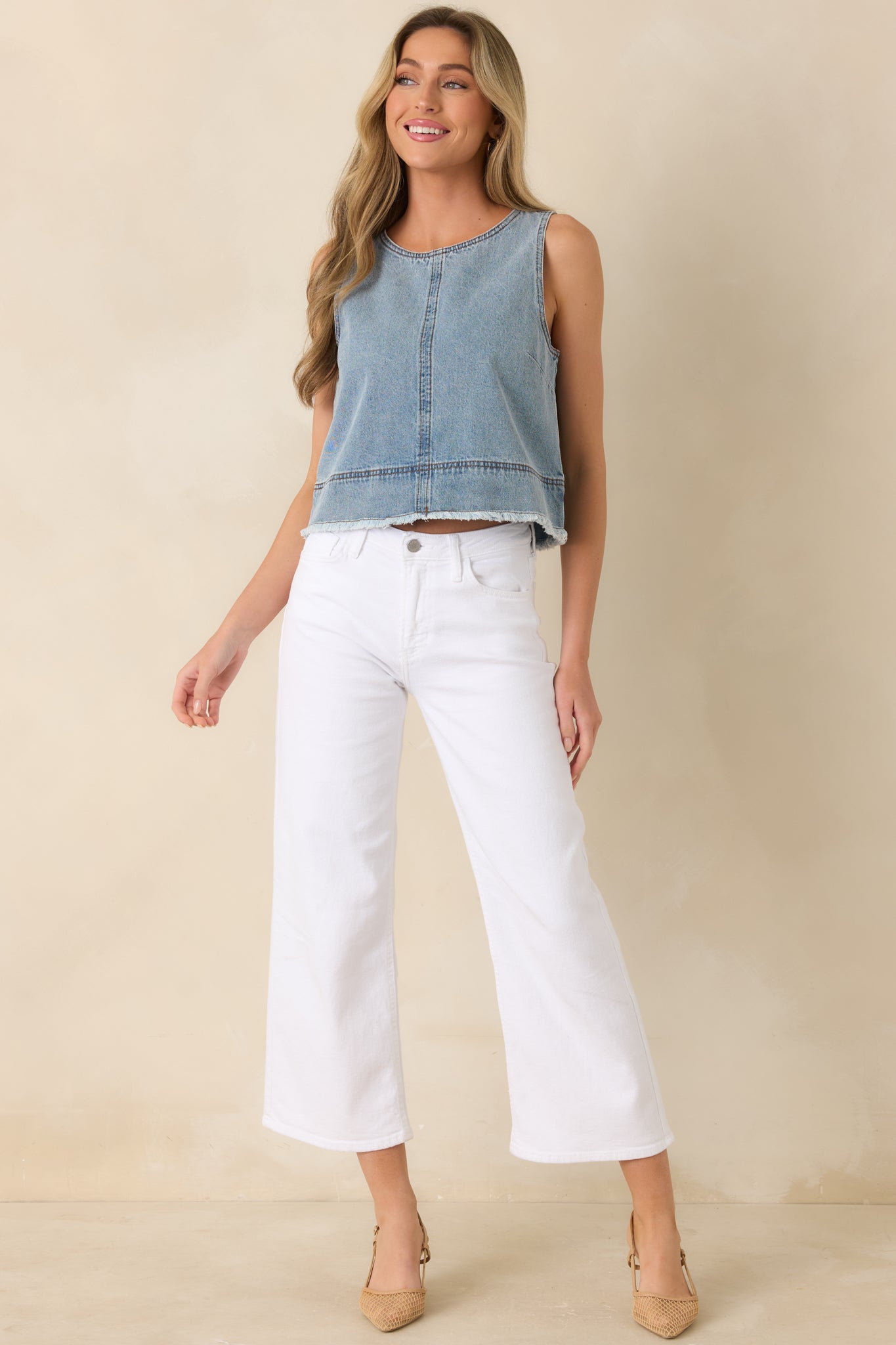 Cotton denim top, featuring a light wash finish, clean structure, and a softly cropped hemline.
