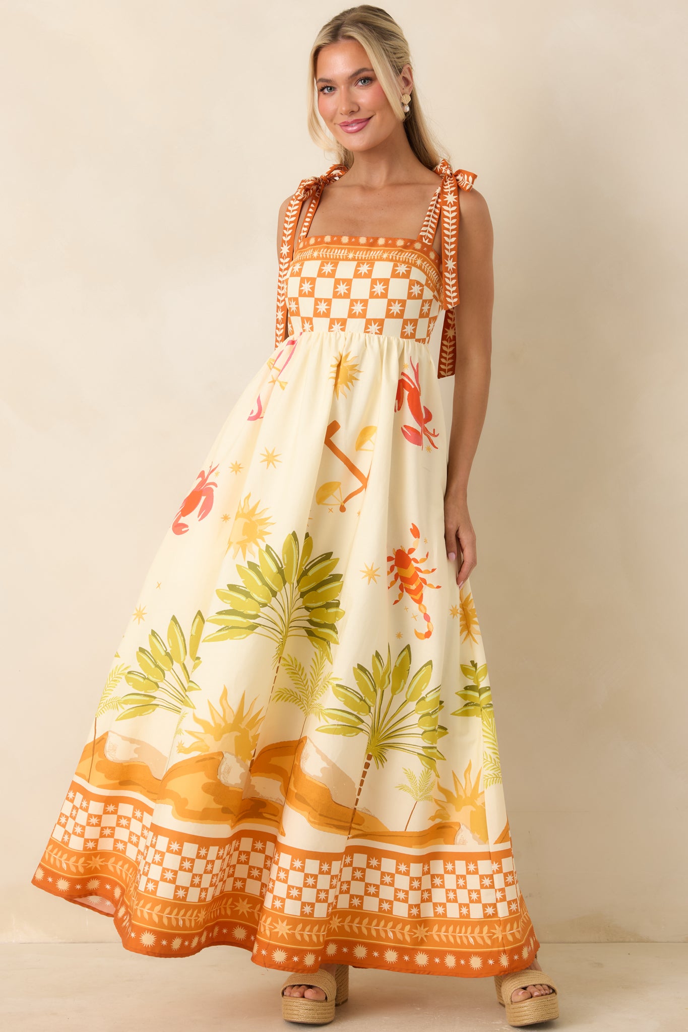 Cotton maxi dress featuring mixed pattern detailing and statement border print.