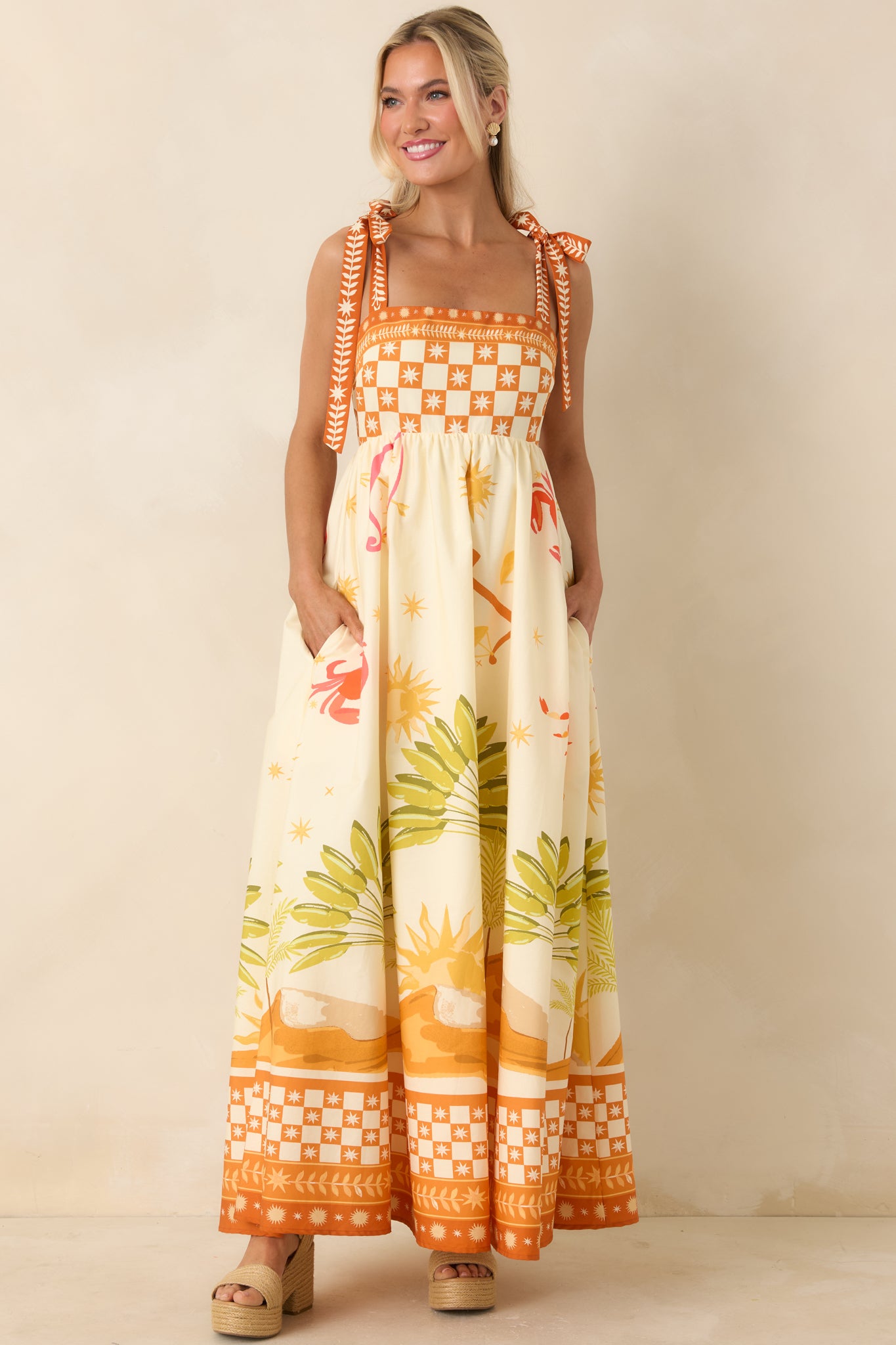 Maxi dress with structured bodice, side pockets, and lightweight flowing skirt.