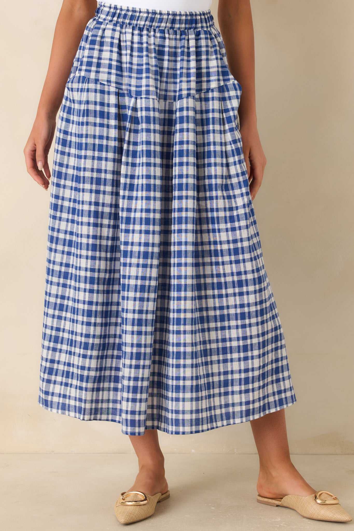 Cropped detail of flowy skirt with relaxed drape and subtle volume.