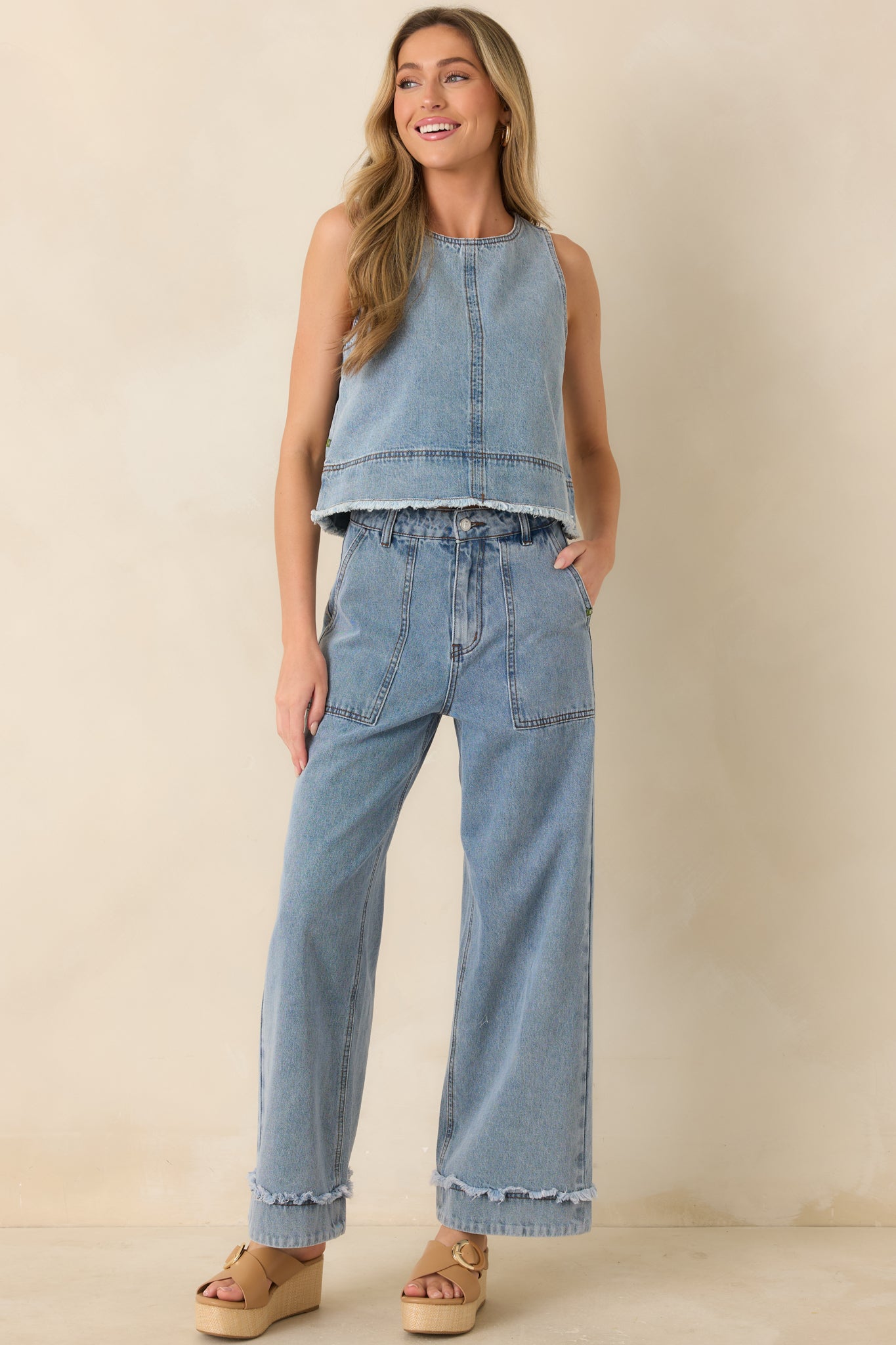 Wide leg jeans, in a light wash denim with front patch pockets and a clean, elongating shape.
