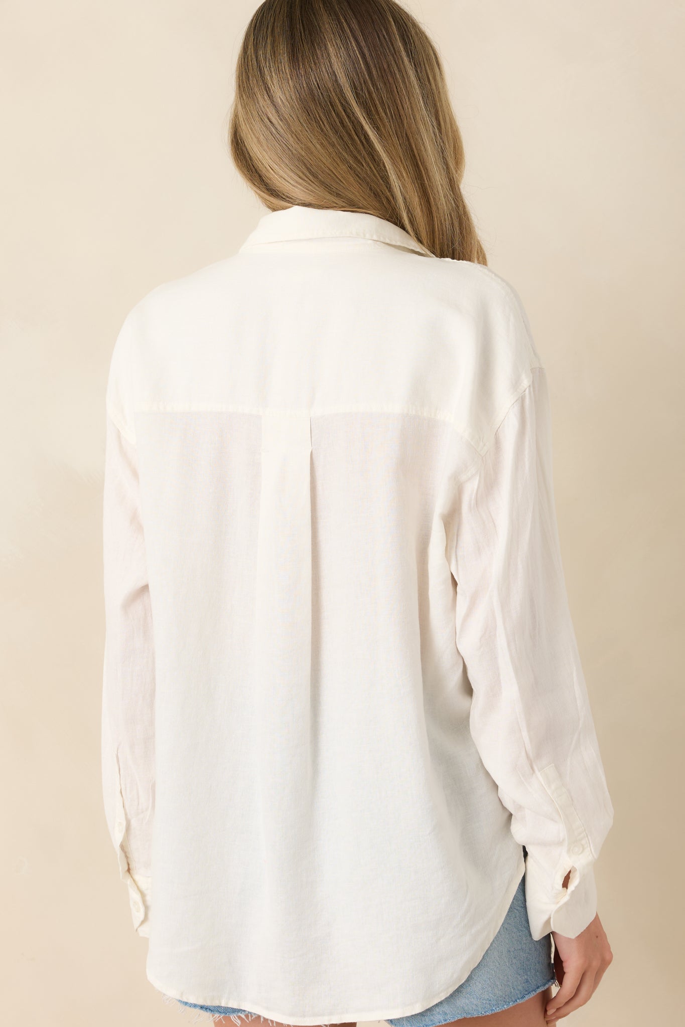 Rear view of white linen blend button-down top with relaxed silhouette.