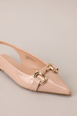Close up of the hardware of these Chic pointed-toe flats with gold hardware and adjustable heel strap.