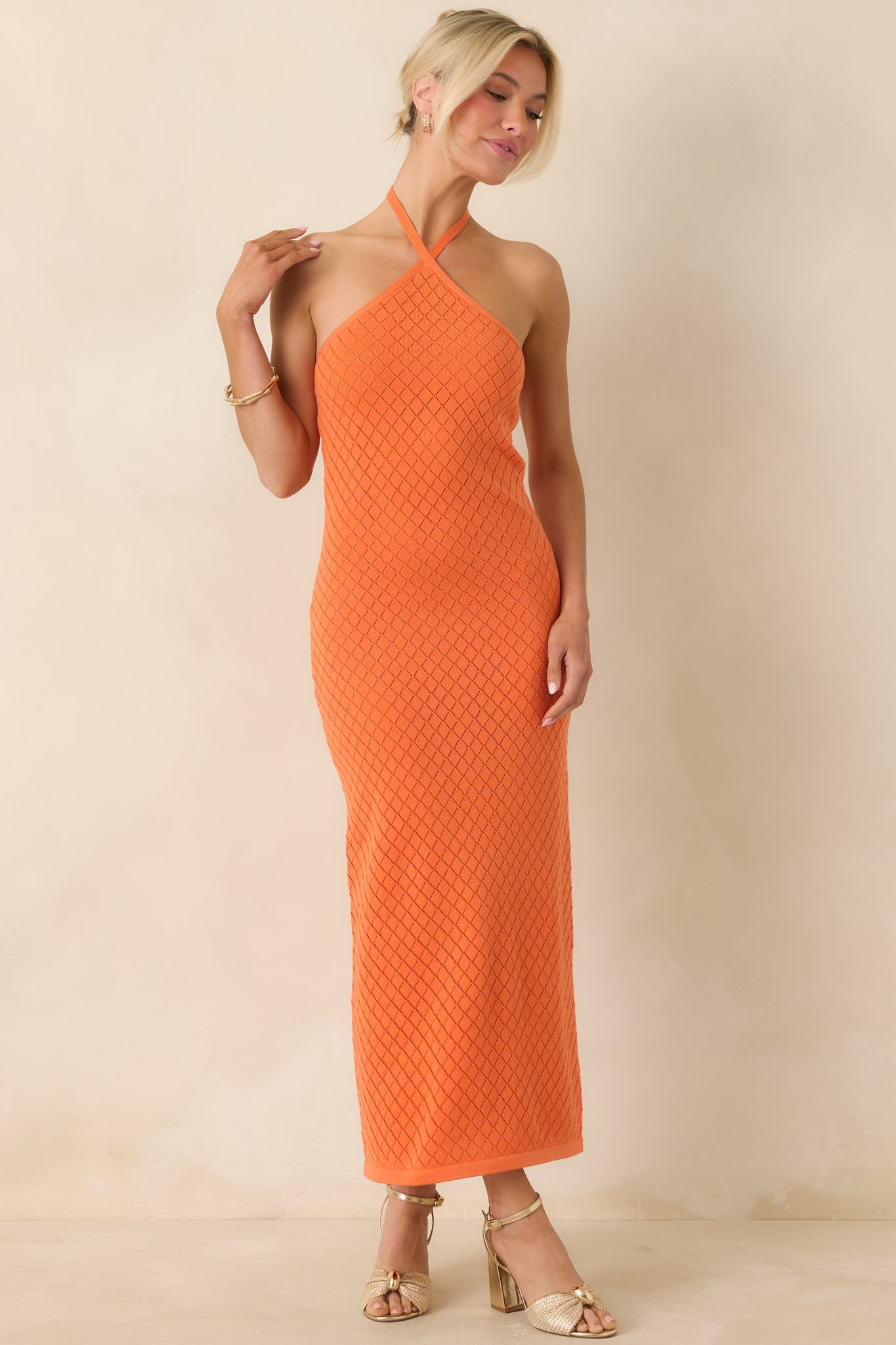 Fitted dress featuring subtle diamond knit texture and streamlined shape.