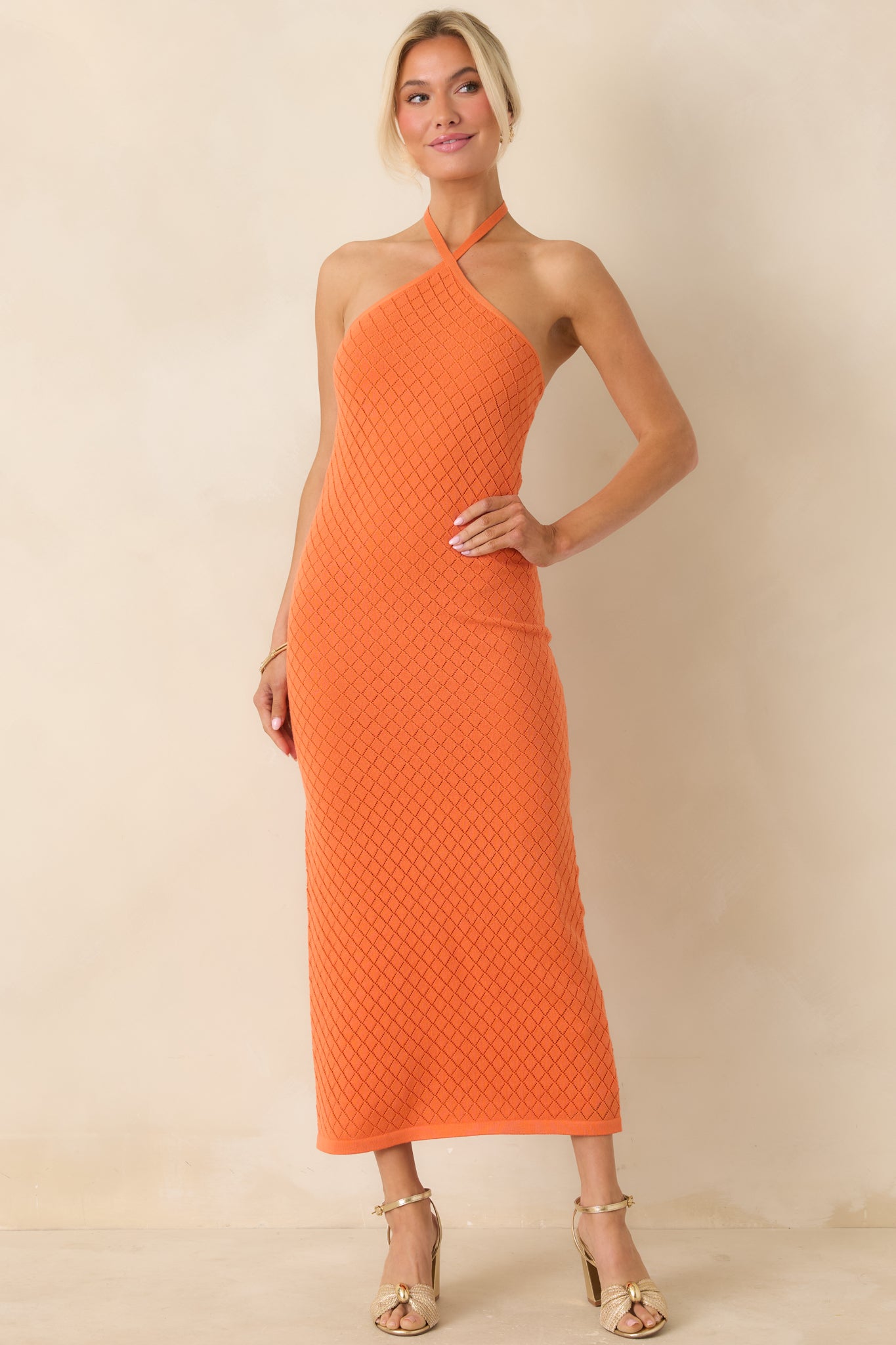 Knit dress with body-skimming silhouette and subtle textured detail.
