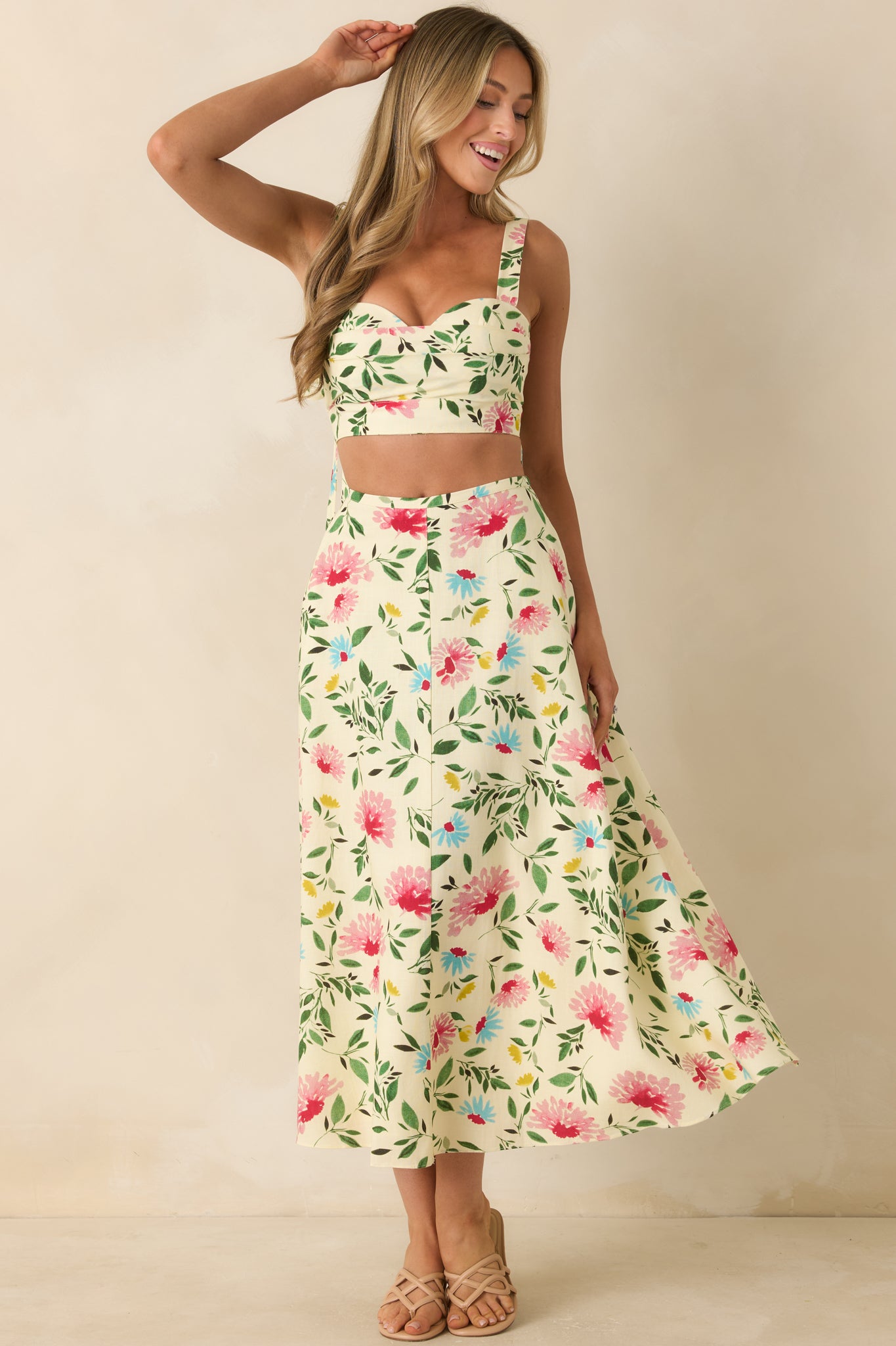 Floral print crop top showcasing pleated bust detailing and a fitted, smocked elastic back for a secure shape.