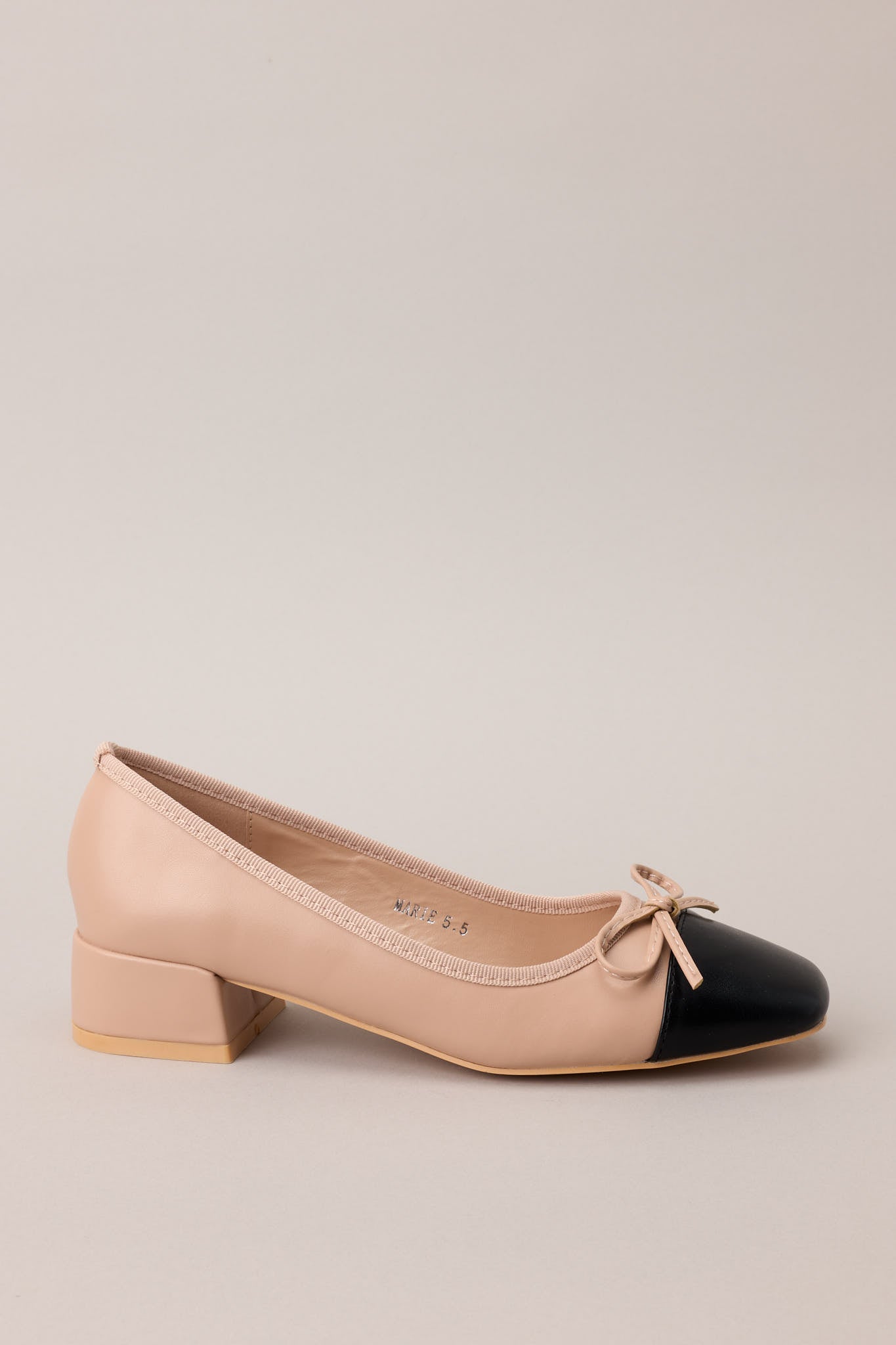 Side crop of the heels showing the square toe shape and soft bow detail across the top.