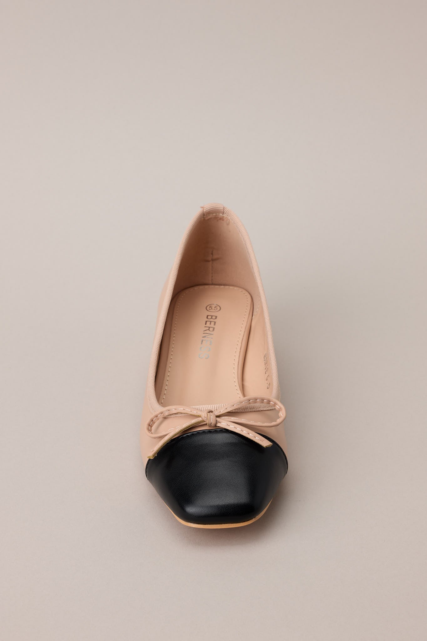 Top-down view showcasing the square toe and subtle contrast in color blocking with the bow detailing.