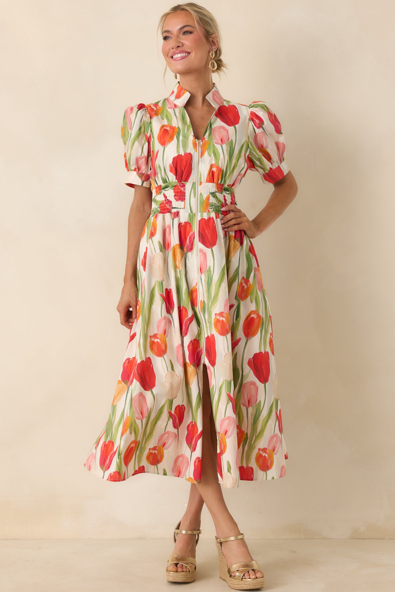 Tulip print midi dress on an ivory base featuring a structured bodice, puff sleeves, and a full flowing skirt.