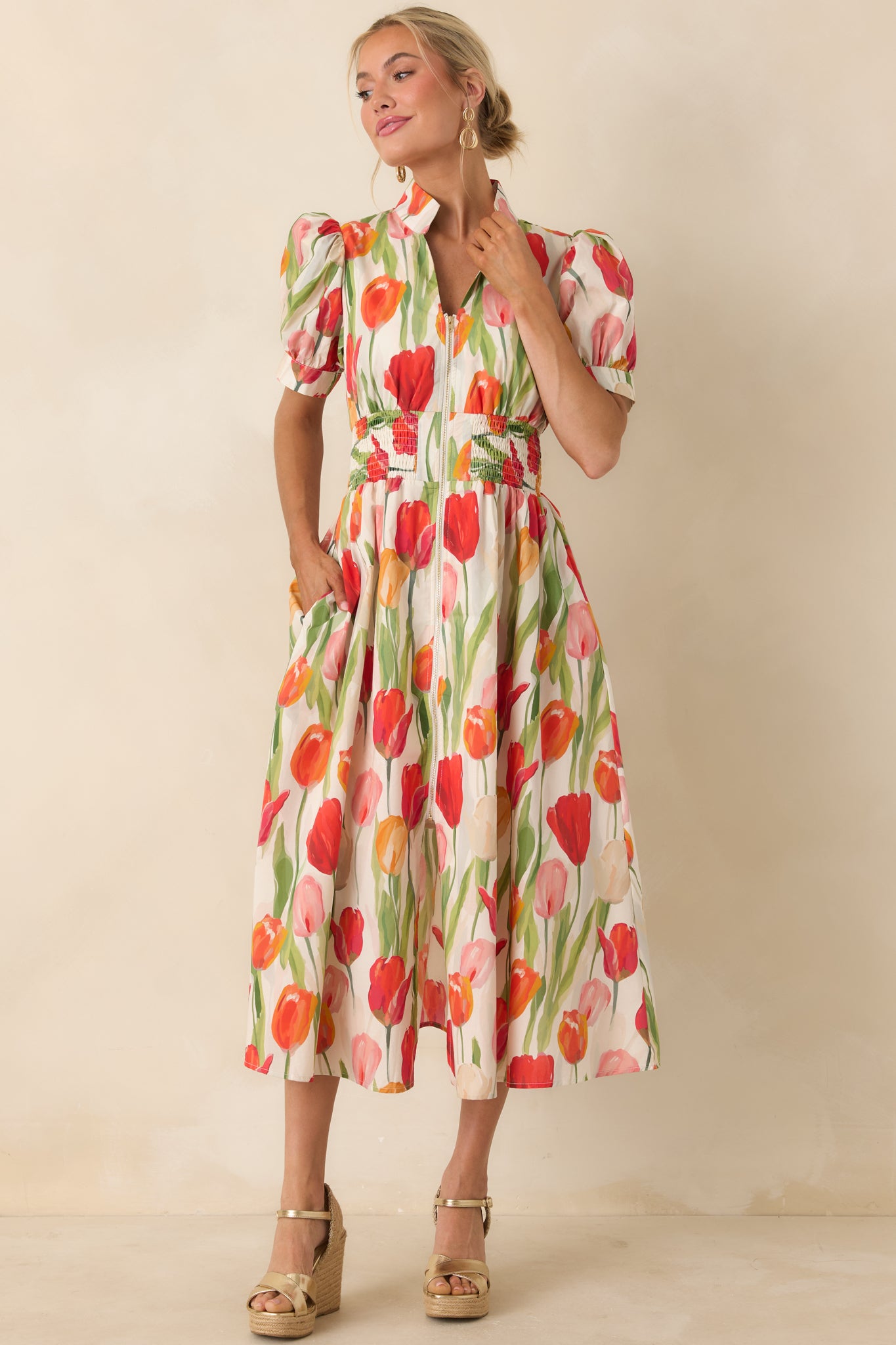 Ivory tulip print dress with zip front closure, fitted smocked waist, and softly voluminous skirt.