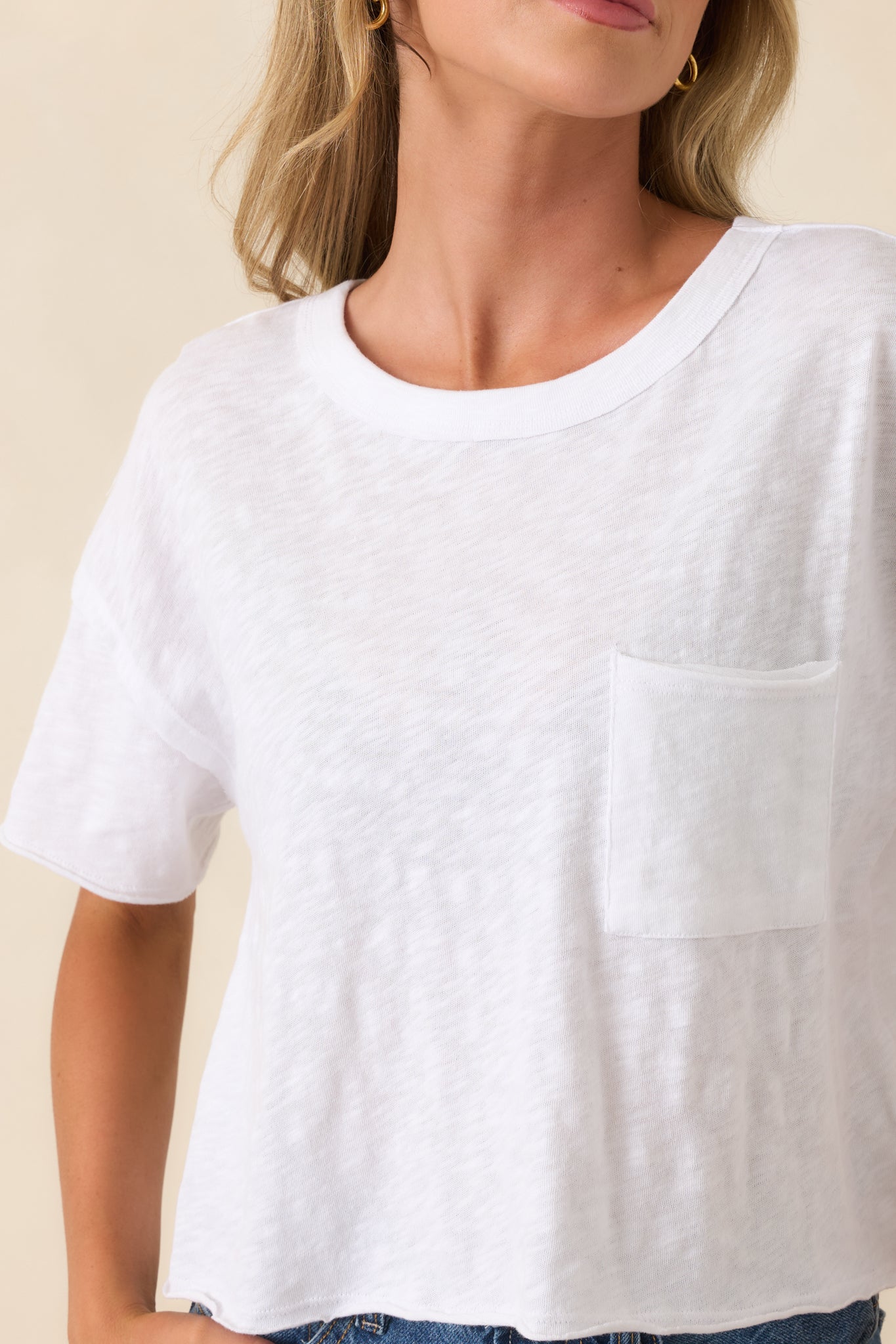 Detailed look at cotton fabric with front pocket stitching and clean seam finish.