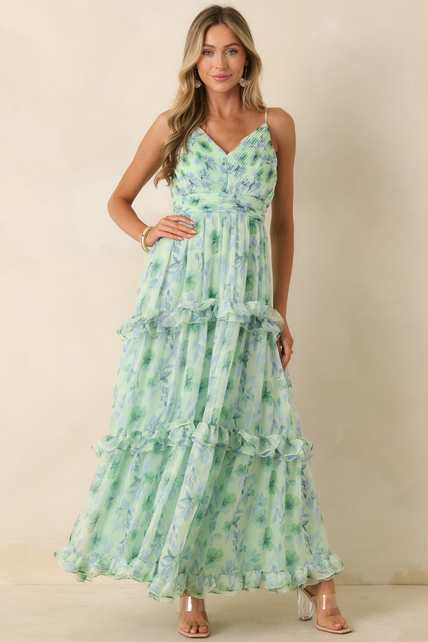 Elegant maxi dress featuring a surplice V-neck bodice and a flowy, full-length chiffon overlay.