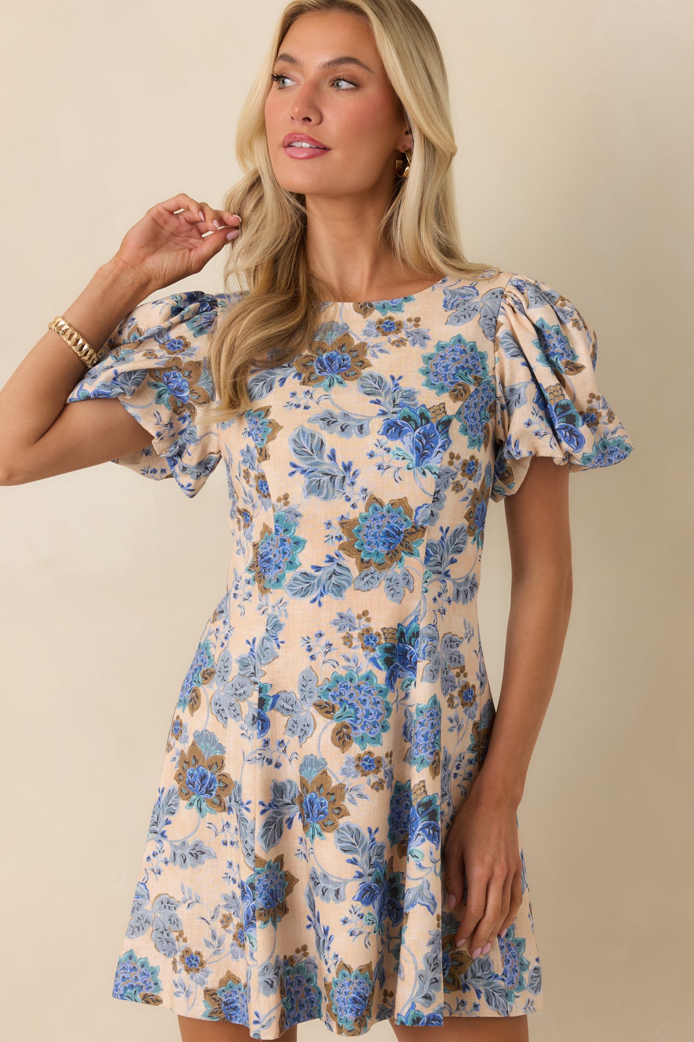 Subtle A-line skirt flow with lightweight floral fabric detail.