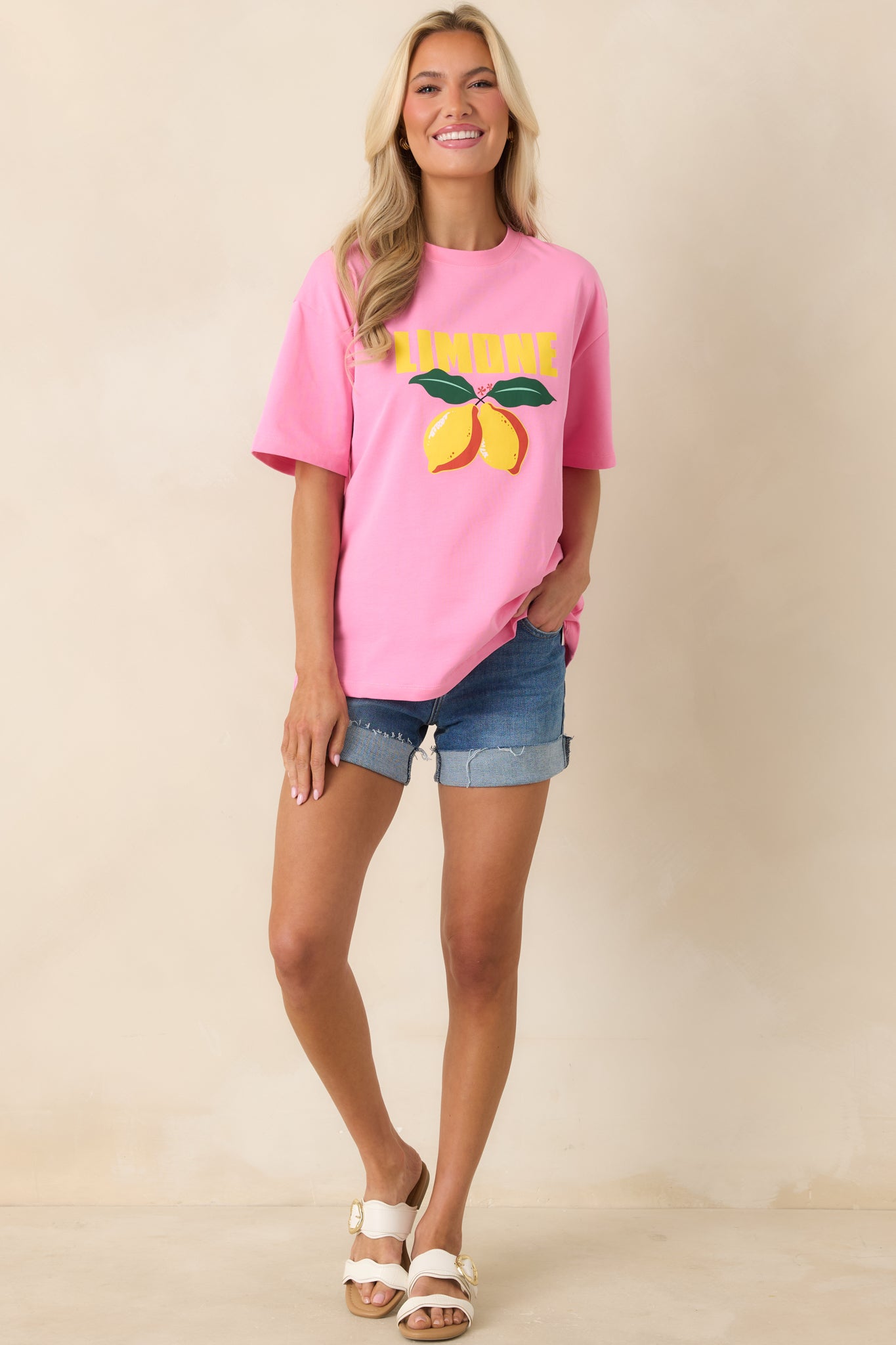 Relaxed pink tee with bright citrus graphic and effortless drape.