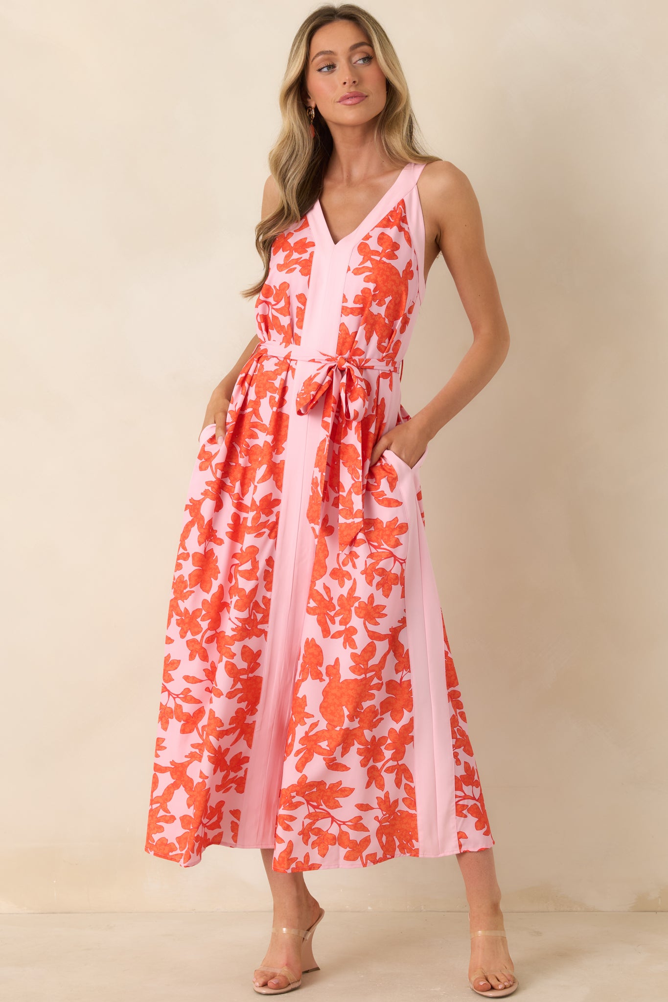 Bright floral print dress with adjustable tie belt, flattering V-front neckline, and soft, flowing hem.