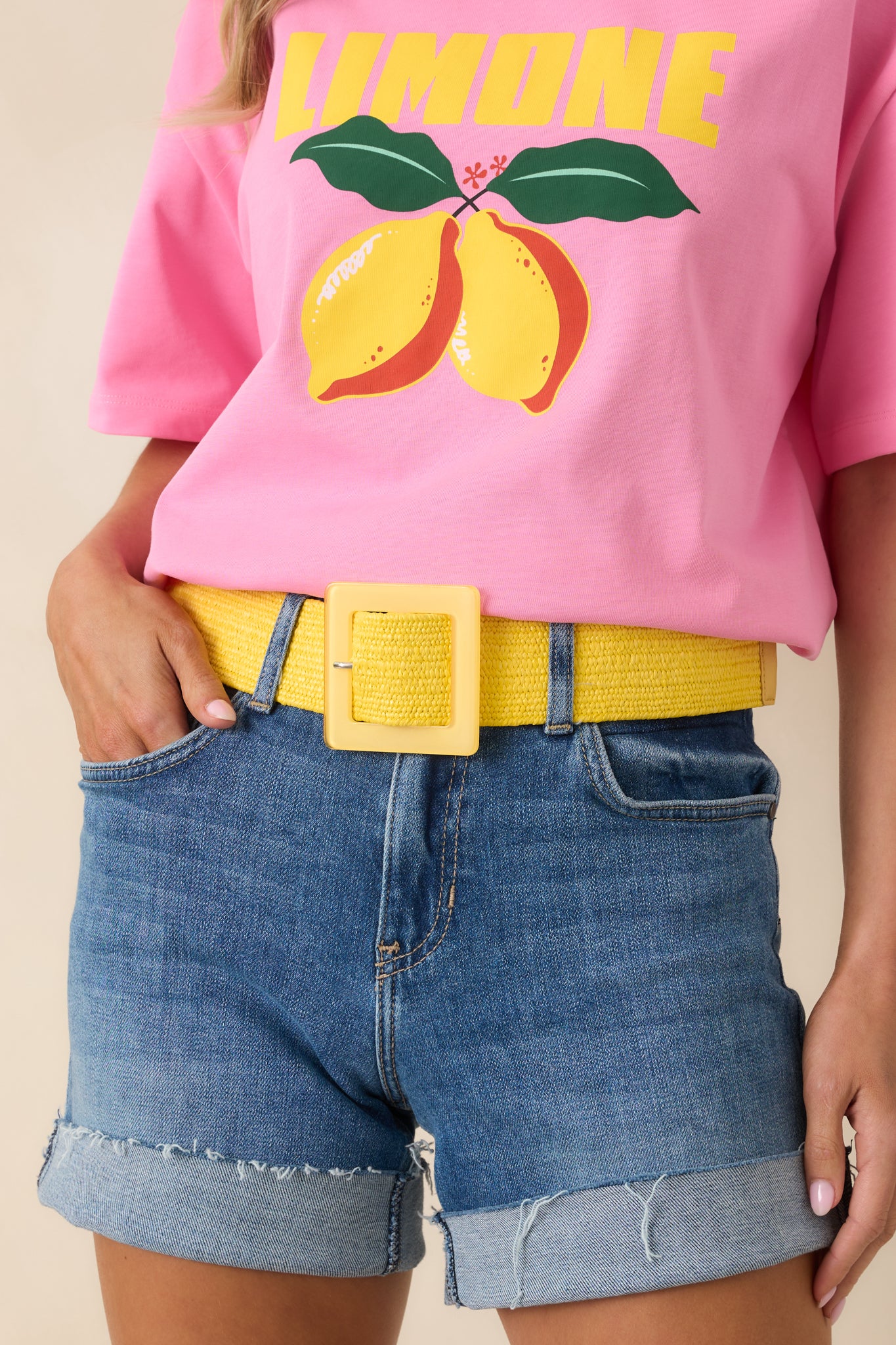 Close cropped angle highlighting textured elastic weave and adjustable yellow buckle detail.